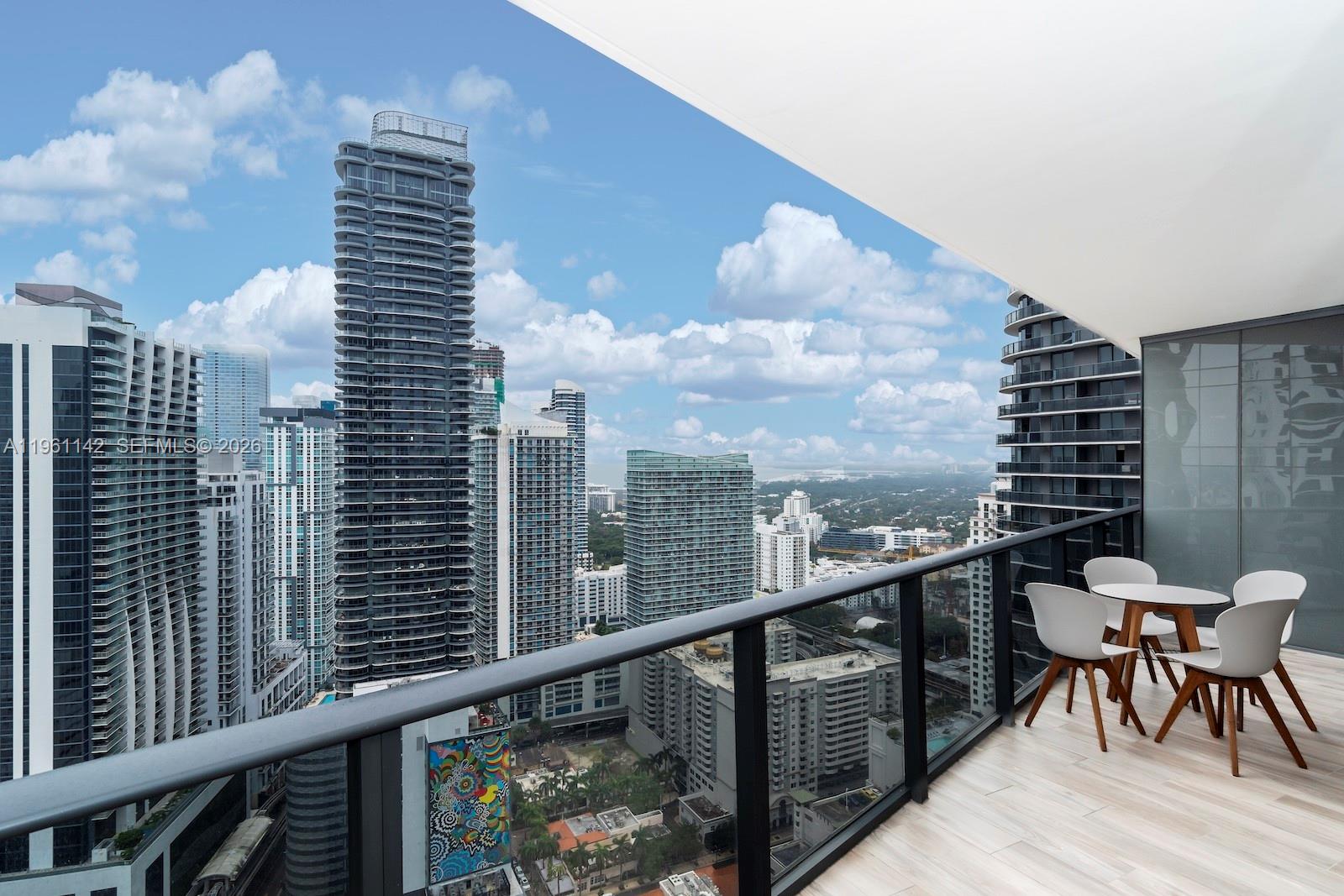 Offered fully furnished and sold As-Is, this high-floor residence at SLS Lux Brickell delivers elevated living in the heart of Brickell. Unit 3803 is a bright 1-bedroom plus den/library/office with 1 full and 1 half bath and 838 SF under air. The open-concept layout features ceramic flooring, a modern kitchen with a cooking island and built-ins, and generous storage with closet cabinetry and walk-in closets. Enjoy bay and city views from the open balcony, plus the ease of in-unit washer/dryer and central A/C. Full-service conveniences include secured lobby/elevator access, valet, and 1 garage space. Residents enjoy an amenity-rich lifestyle with heated pool, spa/hot tub, sauna, fitness center, basketball courts, BBQ/picnic area, clubhouse/clubroom, business center, bike storage, and a bike/jog path.