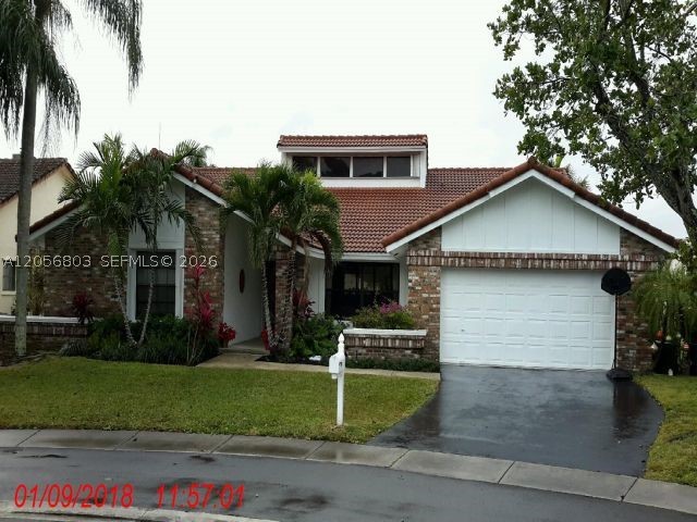 Welcome home to this beautifully maintained, 4 bedroom 2.5 bath updated, pool and waterfront home in Jacaranda Lakes, Plantation. Updated throughout with open concept living.  Newer kitchen with granite and stainless steel appliances, eat in kitchen.  Ample sized living, dining and family rooms.  Step outside to newly renovated pool, patio. Pool surround by child proof fencing, covered patio, and fabulous view of lake.  Convenient to shopping, houses of worship, schools and highways.  This home is a must see!