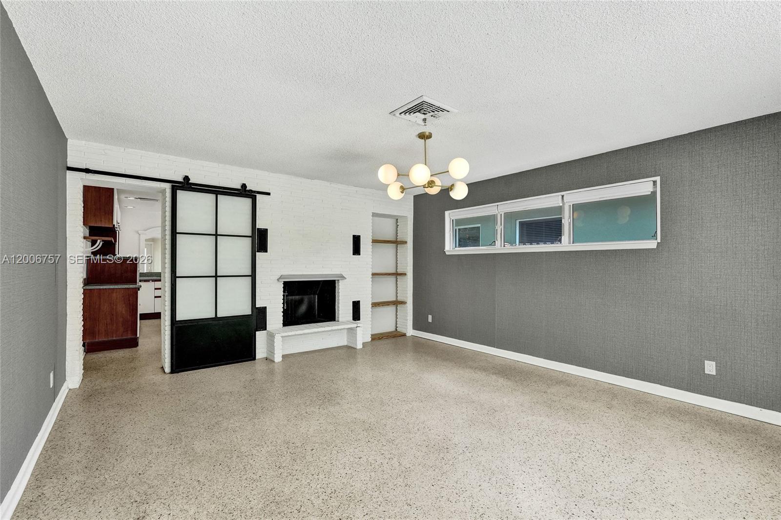 Location truly sets this one apart. Just one block from the Intracoastal, minutes to the beach, and only a few blocks to a waterfront park with kayak launch and windsurfing access. You’re also close to the shops and restaurants that make Lake Worth Beach so vibrant. The layout is designed with privacy in mind, featuring two oversized primary bedrooms on opposite sides of the home with the kitchen centrally positioned. Character details throughout include terrazzo floors, a fireplace, barn doors, and a spacious eat-in kitchen. Step outside to a solar-heated pool surrounded by lush tropical landscaping, creating a private outdoor retreat. Easy to show. Click on showing time.