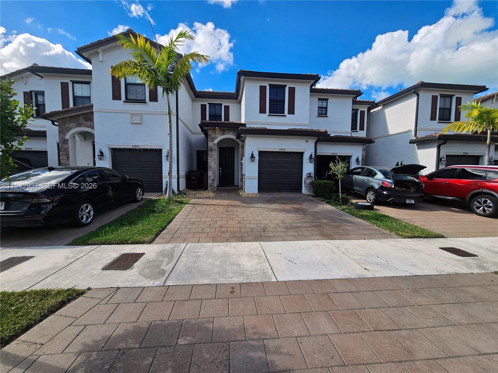 Beautifully maintained townhouse in the desirable Aquabella Community. This home offers 3 spacious bedrooms and 2.5 bathrooms, featuring an inviting open-concept kitchen that flows seamlessly into the dining and living areas. The property includes a one-car garage, an extended driveway with room for up to two additional vehicles, and a cozy backyard ideal for relaxing or entertaining. Showcasing attractive finishes throughout, the home is conveniently located near major highways including the Turnpike, Palmetto Expressway, and I-75, and just minutes from shopping centers, supermarkets, gas stations, Walmart, and other everyday conveniences. An excellent opportunity to own a well-appointed home in a prime, well-connected location.  Schedule your private showing today.