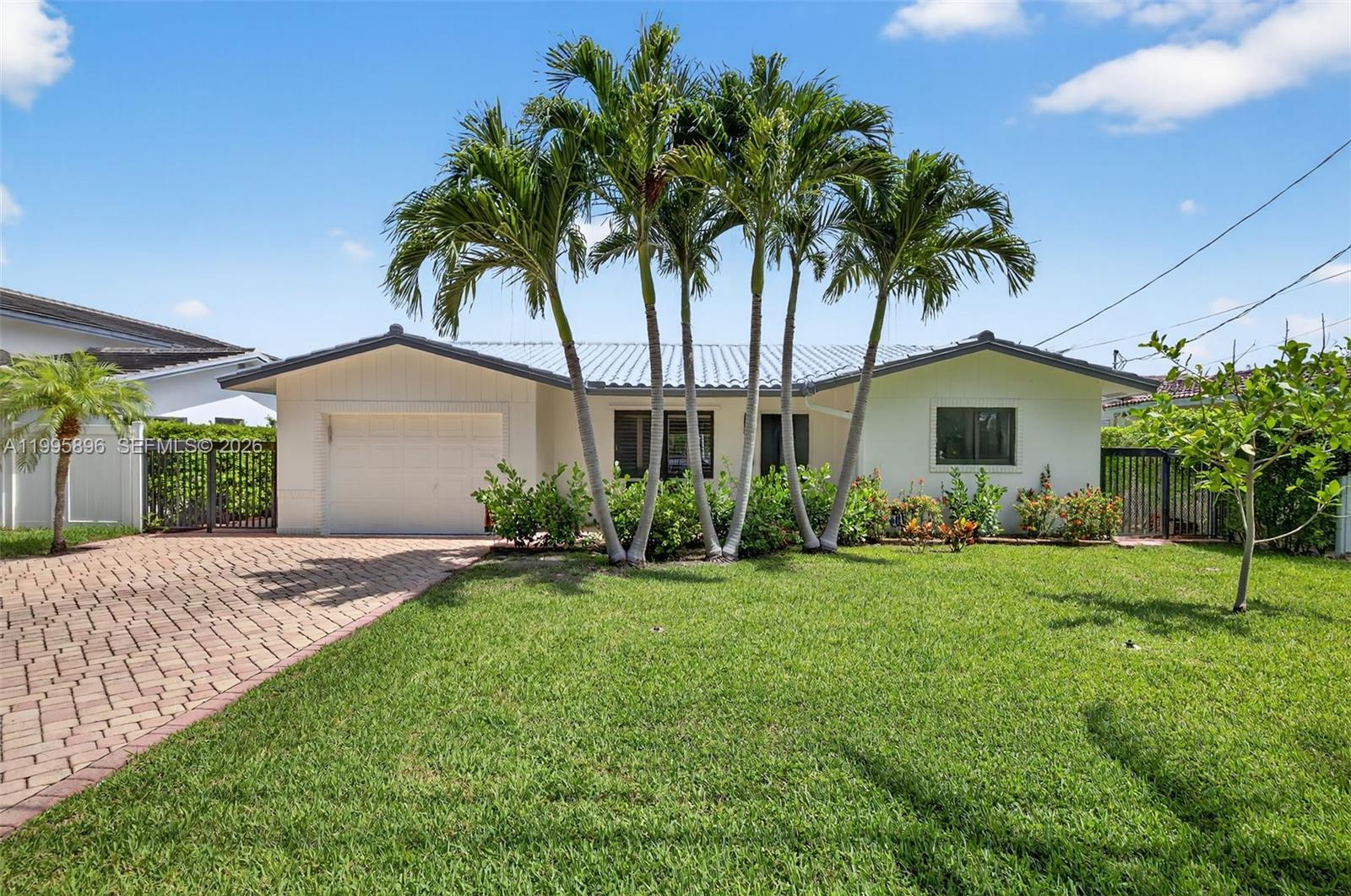 No fixed bridges and just minutes to the Intracoastal! Extensively renovated waterfront home with $137K in upgrades and a recent major price improvement. Stunning 3-bedroom, 3-bath residence in Pompano Isles with 60 feet of water frontage. This move-in-ready home features new impact windows and doors, new HVAC, upgraded electrical, and PVC sewer lines. Enjoy a bright, open layout with luxury flooring, a renovated kitchen with new Whirlpool appliances, and a spacious living area leading to a large pool and 60’ dock with water, electric, and an 18,000 lb boat lift for vessels up to 40’. The pool features a new heater, pump, filter, and PVC piping. A spacious 375 sq. ft. garage offers potential for future expansion or conversion into additional living space (buyer to confirm with city). Located east of Federal Highway.