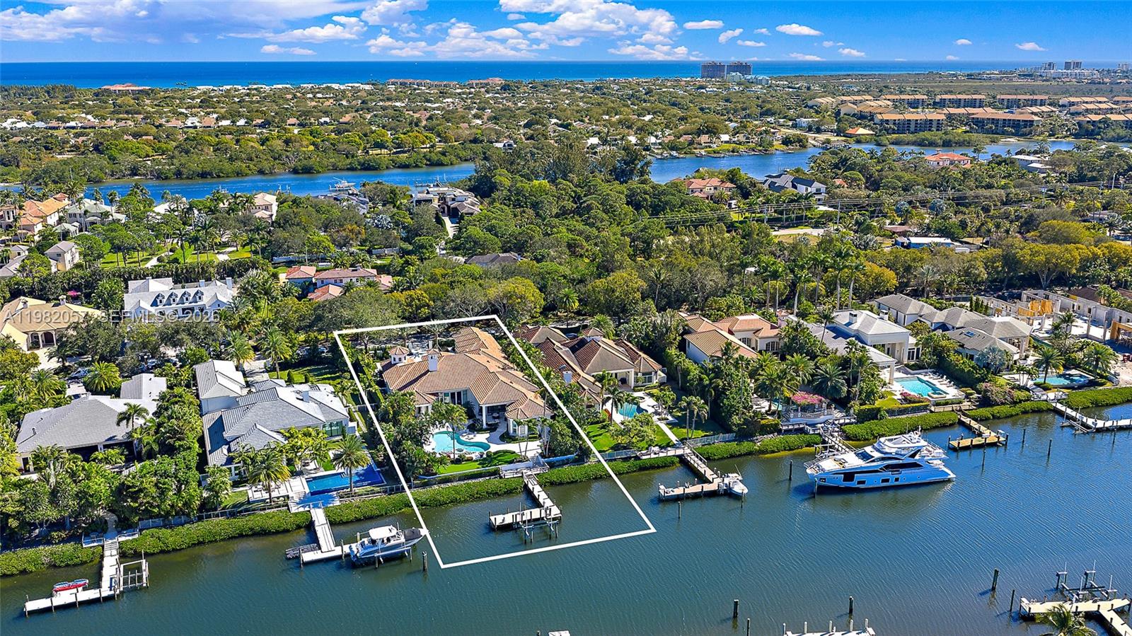 Located in the prestigious waterfront community of Admirals Cove, this beautifully renovated single-story estate offers approximately 7,000 square feet of living space on an oversized lot with a substantial driveway, expansive backyard, and a full golf membership! With approximately 100 feet of waterfrontage, bring your large boats and move right in to enjoy the amazing Admirals Cove lifestyle with no fixed bridges and direct ocean access. Inside, the home features high ceilings and abundant natural light throughout. The kitchen is a standout, with large windows that fill the space with natural light and overlook the outdoor areas and water. Just off the kitchen is a well-appointed bar, creating a natural gathering space for entertaining.

The outdoor areas feature a pool, spa, and putting green overlooking the water, along with an outdoor kitchen complete with grill, wet bar, and mini refrigerator. The primary suite is generously sized and includes a spa-like wet room bath, offering a clean, modern design. Residents of Admirals Cove enjoy access to an exceptional collection of amenities, including a full-service marina, 45 holes of championship golf, two clubhouses, two driving ranges, tennis and pickleball facilities, a state-of-the-art fitness center, luxury spa, and multiple waterfront dining venues. The club also offers an active social calendar and world-class service, making Admirals Cove one of the most sought-after private club communities in South Florida.