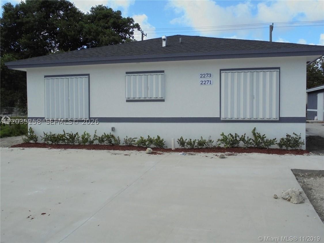 Excellent investment opportunity. Duplex featuring two spacious 3 Bed / 2 Bath units, both currently leased and generating immediate income. Built with safety in mind, the exterior offers complete peace of mind with hurricane shutters, a secure gated front porch, and ample private parking. Located just minutes from I-95 and the airport, this high-demand property is perfect for an investor seeking strong rental. The kitchen is fully equipped with granite countertops, a center island, and stainless-steel appliances (stove, microwave, and refrigerator).