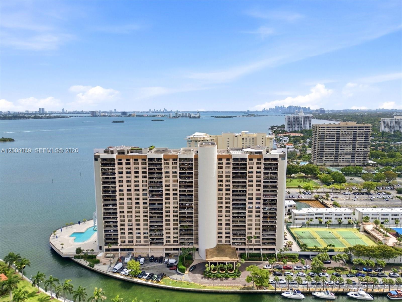 Enjoy spectacular direct bay views from this sought-after 05-line unit in the iconic Cricket Club Condo. Rarely available, this 1,950 sq ft residence offers a bright, open layout, private balcony, 2 A/C units, and space for a possible third bedroom. An 8x10 storage closet on the same floor is included. HOA covers cable, Wi-Fi, landline, water & sewer. It also covers air conditioning which means a very low electric bill. Unit includes 2 assigned valet parking spaces, with option for a third for a fee. Residents enjoy a beautifully positioned bayside pool, walking track, well-equipped gym, library, kids’ playground, tennis, pickleball, basketball, and the peace of mind of 24-hour gated security in a full-service waterfront community.