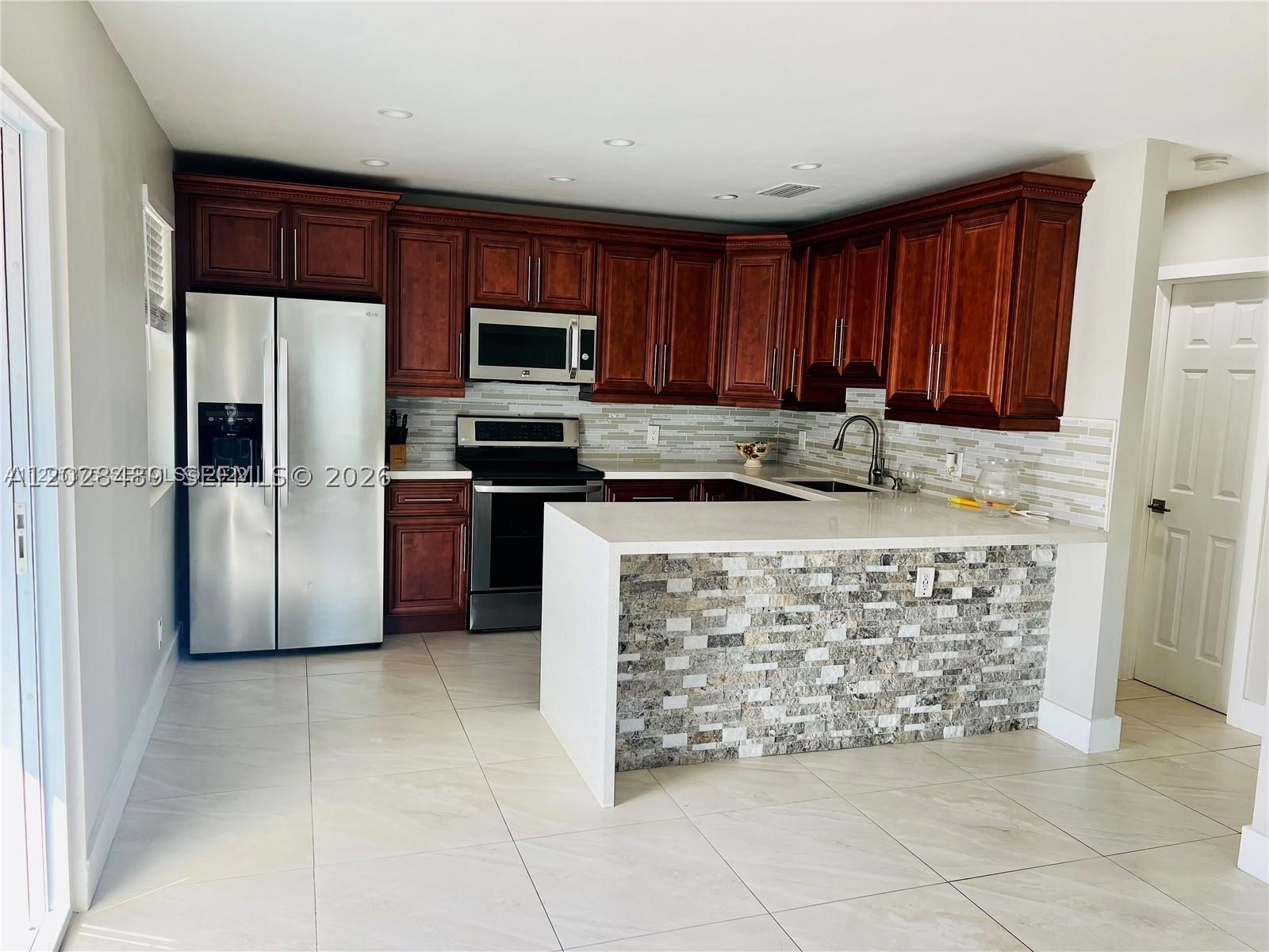 Immaculate 2 Bed/2 Bath duplex unit in Hallandale Beach! This elegant unit is completely updated. Featuring hurricane impact windows and doors, spacious Kitchen with stainless-steel appliances and quartz countertops, modern style Bathrooms, tankless water heater, and security cameras around the property. This unit also includes a dedicated Laundry Room with washer and dryer, a laundry sink, and built-in cabinets. Enjoy your private Patio area and additional storage space in the on site storage sheds. Water and trash service are included in the rent. Located on a quiet street, this bright and comfortable home offers convenient access to everything South Florida has to offer, including Gulfstream Park, Aventura Mall, beaches, restaurants, shopping, major highways, casinos, and public transportation. Renter's insurance required. 650+ credit score is preferred. Applicant(s) must complete a background, credit, and eviction screening. Verifiable income and employment required. Credit history, rental history, and overall application strength will be considered. No prior evictions. Pets permitted with owner approval. All pets must be disclosed and approved by landlord prior to move-in. First month's rent, last month's rent, security deposit, and any applicable pet deposits due at lease signing. Fast approval process.