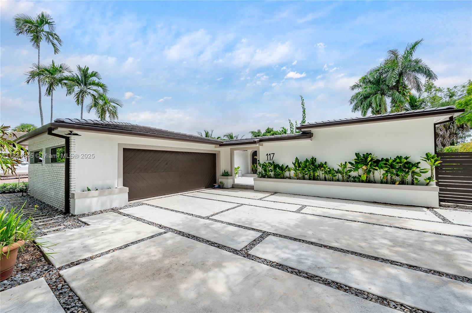 Welcome to Your Dream Home in Miami Springs! Completely redone within the last three years, this beautifully renovated 4-bed, 3-bath pool home sits on an oversized lot with a 2-car garage and thoughtful upgrades throughout. Enjoy a bright, open layout with restored oak floors, a spacious modern kitchen, and inviting living areas perfect for gatherings. The split floor plan offers privacy, with a luxurious primary suite featuring a spa-like bath. Step outside to a gorgeous tiled pool and refinished deck, ideal for relaxing or entertaining. Everything—from roof, electrical to plumbing—every inch of this home has been redone with care and style. Located in Miami Springs, a charming neighborhood minutes from the future Miami Freedom Park. Larger than tax roll, close to 2,750 sq ft as per owner