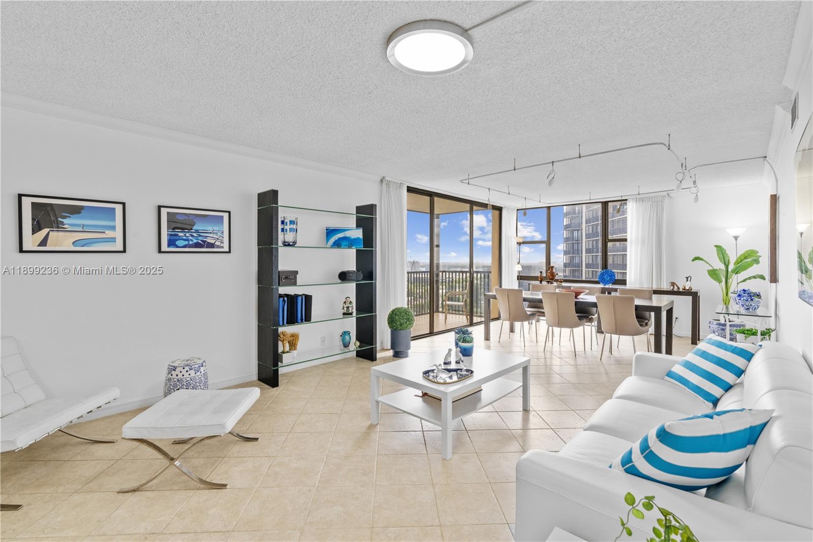 Elegant high-floor corner unit offering panoramic views of Turnberry Golf Club, Aventura, and the Sunny Isles skyline. This pristine 2BR/2BA features a custom kitchen with sleek black granite countertops and GE stainless steel appliances. Enjoy resort-style living in a recently renovated building with a modern lobby, new elevators, and completed 40-year recertification. Amenities include a heated pool, hot tub, gym, sauna, 24-hour security, and laundry on every floor. HOA covers water, cable, and internet. Close to beaches, Aventura Mall, fine dining, and entertainment.