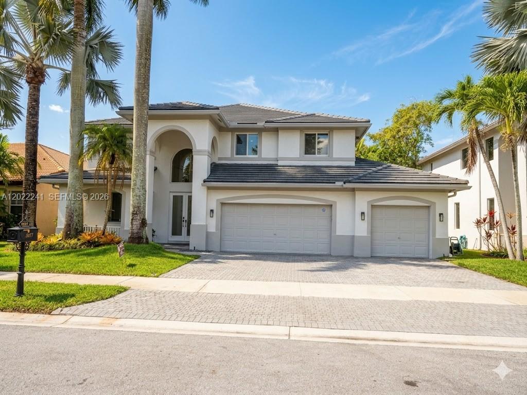 Welcome to Hunters Pointe at Weston Hills Country Club. Boasting absolute peace of mind, this home features complete impact windows and doors and a brand-new flat tile roof.
Step inside to a beautifully illuminated floor plan featuring freshly painted interiors and completely remodeled, modern bathrooms. The heart of the backyard is a pristine, screen-enclosed pool area, perfect for outdoor living. The pool was remodeled 8 years ago, features a heater for year-round enjoyment, and offers breathtaking, serene views of the wide lake.
The property also includes a spacious 3-car garage and a beautifully landscaped lot. Located in Hunters Pointe, just a short walk to the park with children’s playground and a soccer field. All of this, plus Weston’s A-rated schools and guard-gated security. Don’t miss the opportunity to live in one of Weston's premier neighborhoods!