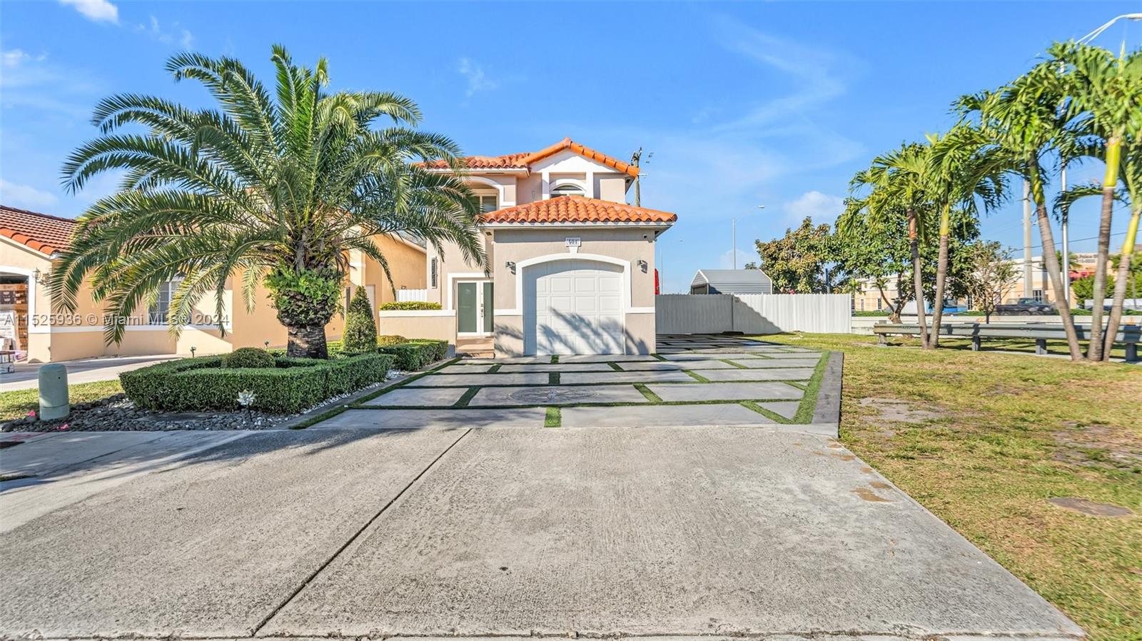 Welcome home to this beautiful 3/2.5 residence nestled in West Hialeah, offering a perfect blend of modern comfort and accessibility. No HOA fees enhance the appeal. The property features a new high-efficiency A/C (2021), impact windows, a Tile roof, and elegant marble flooring. The kitchen is equipped with stainless steel appliances, granite countertops, and wood cabinetry. Zebra-style curtains add a touch of style to all windows. A spacious concrete driveway, one-car garage, carport, covered terrace, and gazebo within a fenced yard adorned with fruit trees make it ideal for those who love being outdoors or who love to entertain. Positioned near major expressways and amenities, this residence effortlessly combines style and convenience, welcoming you to a truly special home! A MUST see!