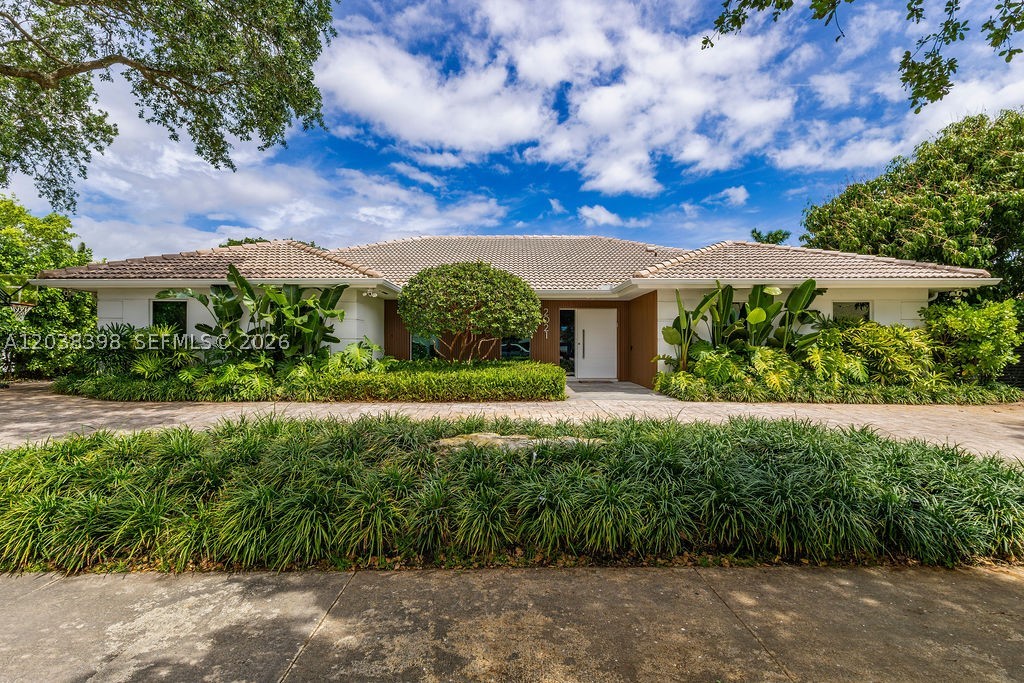 Stunning Renovated Single-Family Home | 5 Bed / 4.5 Bath
Welcome to this beautifully renovated residence where modern elegance meets South Florida living. Lush tropical landscaping and a sleek contemporary facade make an unforgettable first impression.
Inside, an open floor plan flows effortlessly through spacious living and dining areas with polished marble floors, designer finishes, and abundant natural light. The chef’s kitchen impresses with high gloss cabinetry, stainless steel appliances, LED under-cabinet lighting, and a breakfast bar, ideal for entertaining.
The primary suite offers a serene retreat with a botanical accent wall, walk-in closet, and a spa inspired en-suite featuring dual vanities, a glass rain shower, and premium finishes. A private attached gym completes the suite. Four additional bedrooms provide generous space for family, guests, or a home office.
Outside, a resort-style backyard awaits, sparkling pool, expansive sundeck, pergola with BBQ area, and a basketball hoop, all surrounded by lush privacy hedging.
Located minutes from major highways, top schools, shopping, and dining. Move-in ready. This one checks every box.