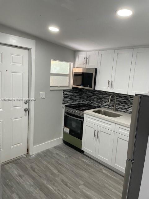 Beautifully renovated spacious 1 bedroom 1 bath located in North Miami Beach. New kitchen with granite countertop and stainless steel appliances, New mini-split AC and recessed lights throughout. Large lot with fenced in yard space. Private entrance and parking. Washer & Dryer is on-Site. Minutes away from Aventura, Sunny Isles Beach, parks, local transportation, dining & shopping. Electricity & Water is included in rent! Maximum 2 people. 24-48hr approval. Requirements are as follows: 1st Month ($1550), Security Deposit ($3100), last 2 months of verifiable income, color copy of photo ID.
