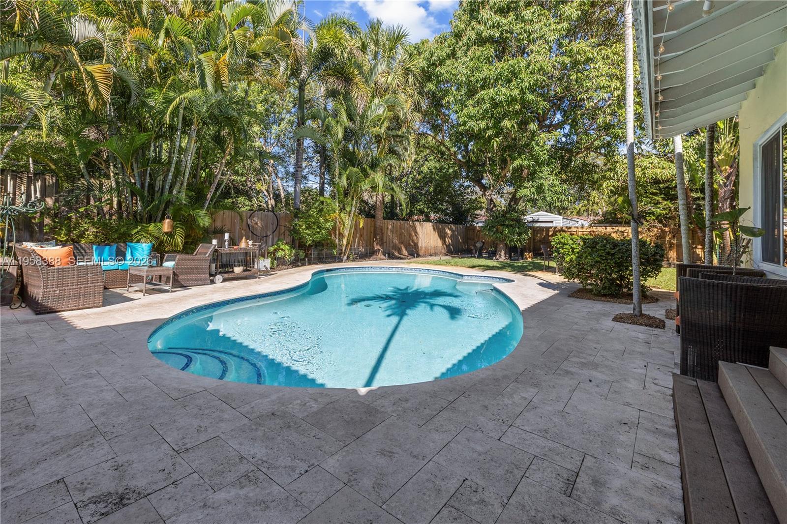 Charming 1950s gem located on a quiet street in a prime residential area of Hollywood. This impeccably maintained 3-Bed, 2-Bath home radiates authentic mid-century character and a unique "soul" that you must see to believe. 
The highlight is the beautiful, lushly landscaped Backyard featuring a signature "peanut-shaped" pool—perfect for quiet evenings or entertaining under the stars. A true sanctuary for those seeking style and serenity. 
You should see it!
"Perfect 'Value Play' for buyers who prioritize atmosphere over cookie-cutter renovations. 
The yard alone is a masterpiece of privacy and charm."