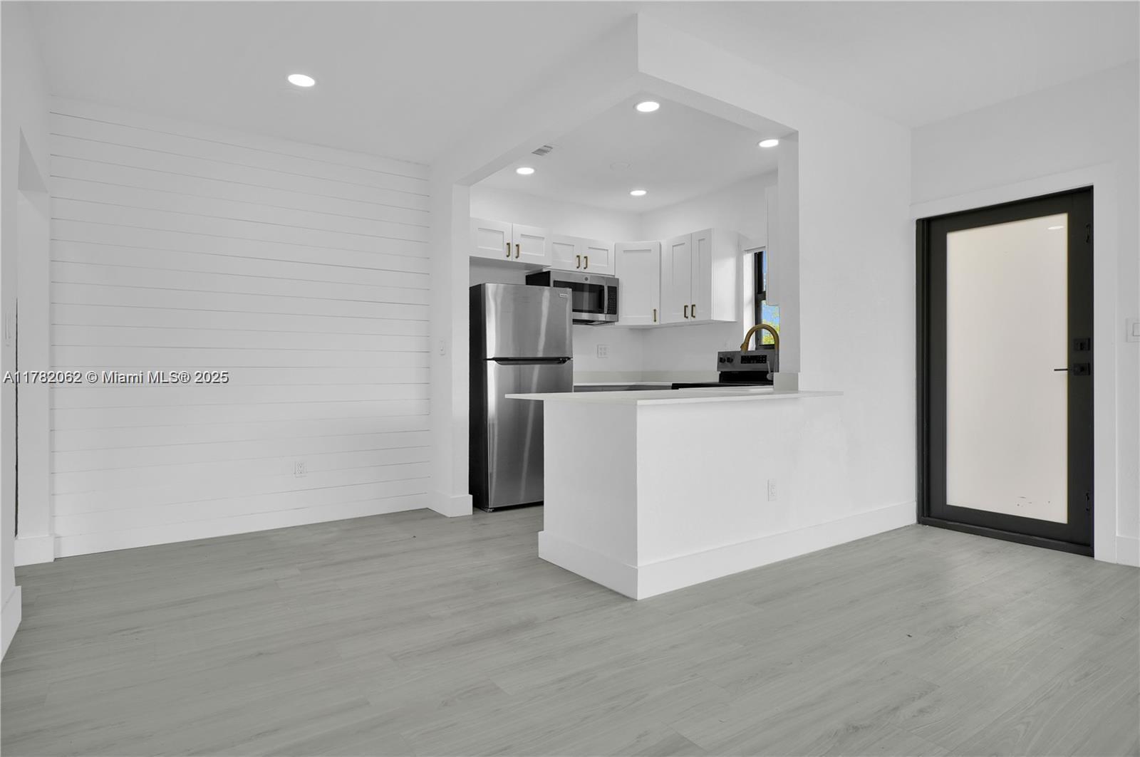 Beautifully remodeled unit in great location. Unit offers 2 Bed/1 Bath, open living/dining area, new floors, new kitchen with s.s. appliances, recessed lighting, impact windows/doors & central A/C. Enjoy your own private Washer/Dryer, 1 assigned parking, and bring your furry friend ? pets are welcome ($20/month pet fee, 50lb max). Tenant responsible for FPL and water.