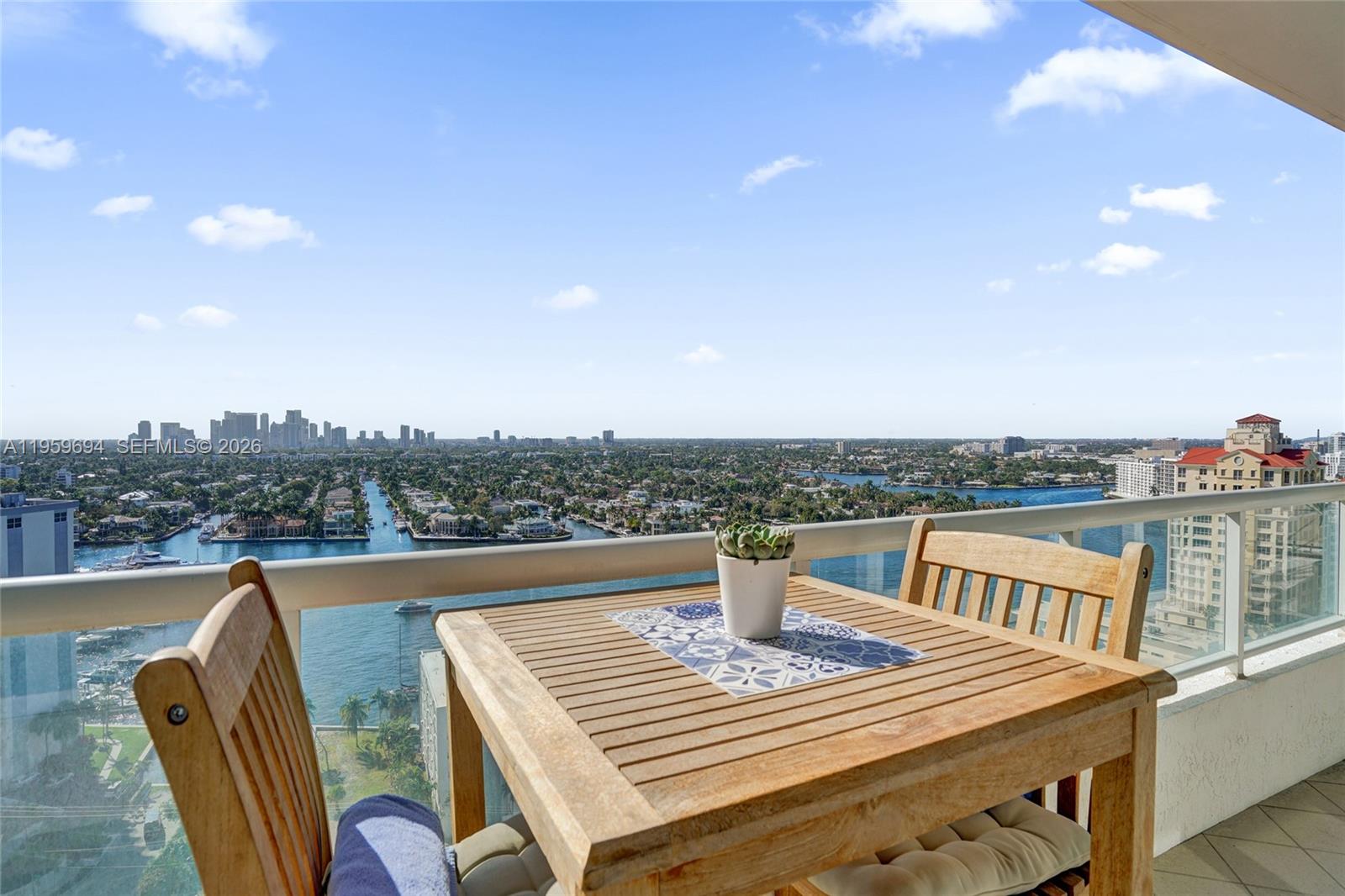 Experience the five-star lifestyle at The Ritz-Carlton Fort Lauderdale Beach. This 18th-floor private residence offers 2 bedrooms and 2.5 baths with sweeping west-facing views of the downtown skyline and Intracoastal, where daily yacht traffic becomes part of your living backdrop. One of only 28 private residences, enjoy a private lobby, dedicated elevators, full-time concierge, and exclusive access to resort-style amenities. The split floor plan provides privacy, anchored by a gourmet kitchen with European oak cabinetry and Sub-Zero/Wolf appliances, while a full-width terrace captures stunning sunsets. Perfectly positioned just moments from Sebastian Street Beach, known for its vibrant, inclusive energy, this residence offers unmatched walkability along Fort Lauderdale’s most desirable beachfront stretch. Located in the Yachting Capital of the World, you are surrounded by premier marinas and a global fleet of mega yachts, with preferred dockage near Las Olas Marina. The upcoming St. Regis Residences and Marina further elevates this corridor, enhancing both lifestyle and long-term value. Enjoy a 10,000-square-foot spa, fitness center, valet, in-room dining, and on-site dining, where luxury, location, and lifestyle converge.