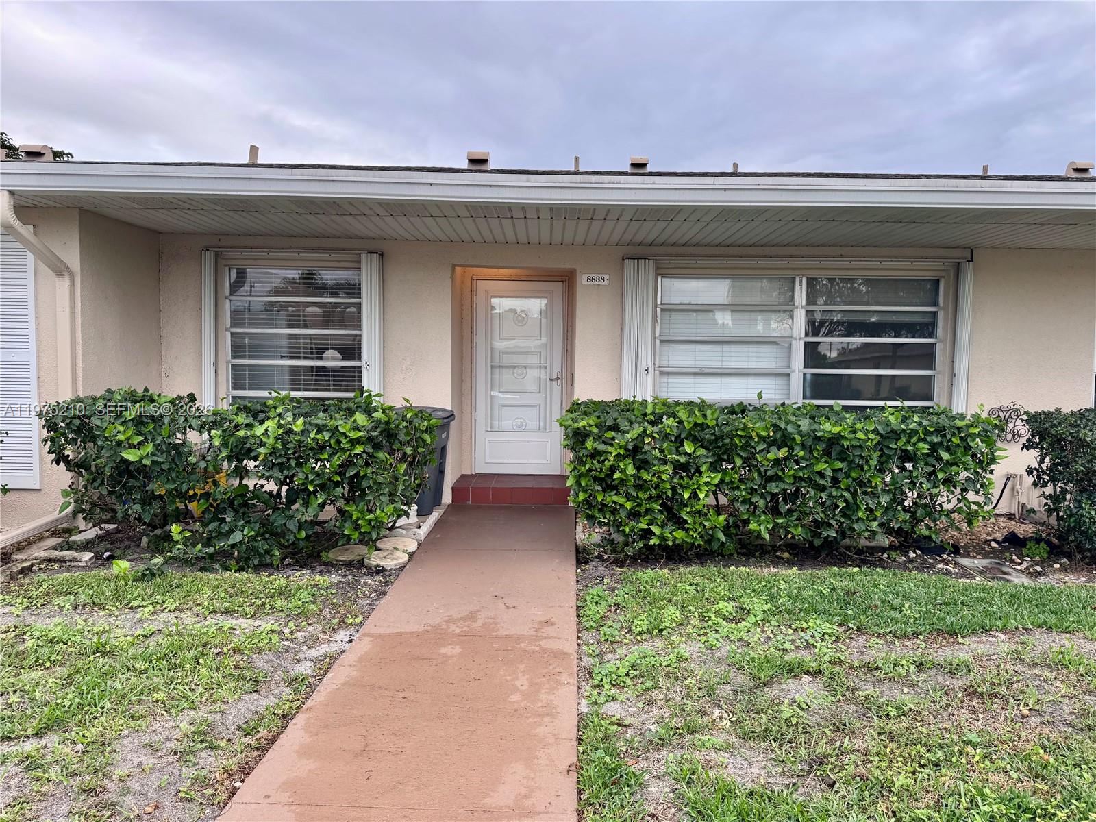 Welcome to this beautifully maintained lakefront villa in a sought-after 55+ community, where comfort, security, and lifestyle come together.

This freshly painted 1-bedroom, 1-bath, 1-den residence offers peaceful water views and one parking space. Wake up to serene lake scenery and enjoy the privacy and tranquility that make this home truly special.

Located in a gated community with 24-hour security, residents enjoy a worry-free lifestyle. The monthly maintenance covers cable, water, sewer, roof maintenance, exterior upkeep, club access, and social activities — simplifying your expenses and enhancing everyday living.

Perfectly positioned near restaurants, shopping plazas, and just minutes from the beach, this villa combines relaxation with convenience.