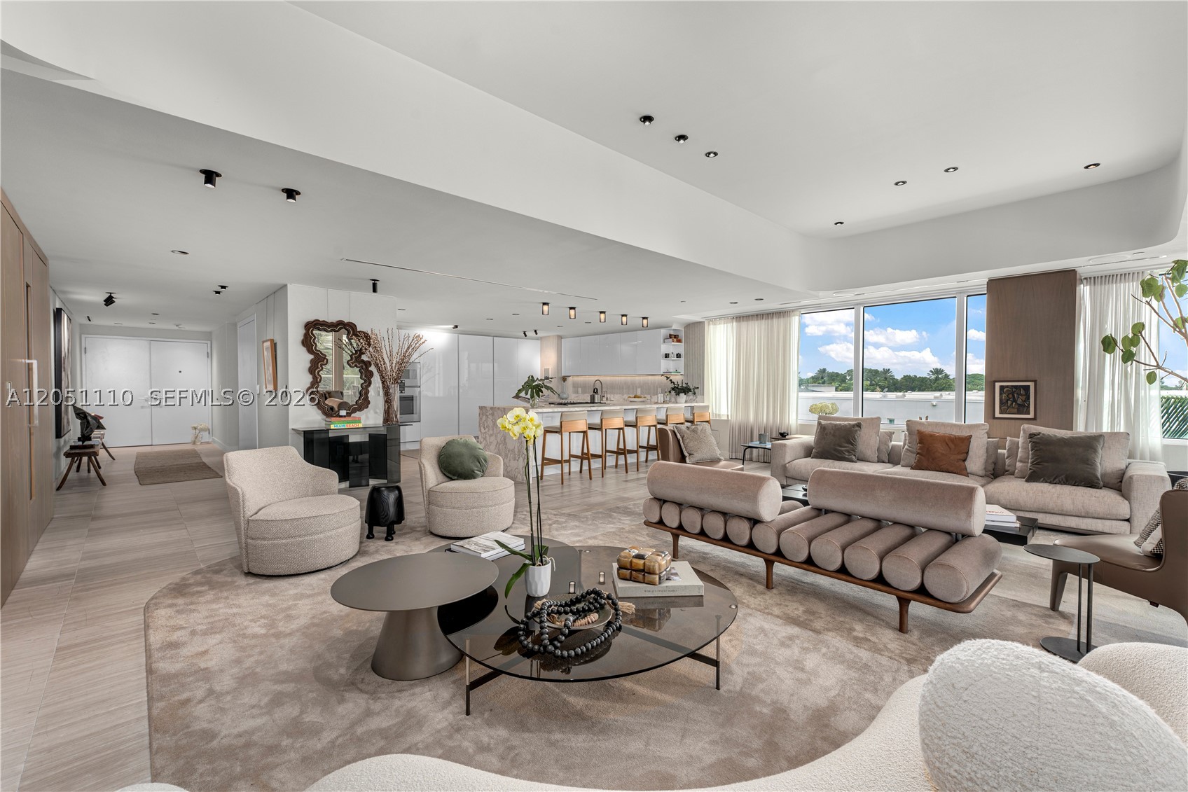 Discover refined waterfront living at The Ritz Carlton Residences Miami Beach, designed by acclaimed Italian architect Piero Lissoni. This 3-bedroom, 3.5-bath,  corner residence captures sweeping views from Surprise Lake to Biscayne Bay, enjoyed best from the private jacuzzi on its expansive covered terrace. The home features a deeded storage unit inside of the unit, automated shades, a custom-built bar with wine storage, and interiors by Decor Adore Design. The open Boffi kitchen with Gaggenau appliances flows seamlessly into spacious living areas, while the primary suite offers a
spa-like bath with a rain shower and jetted soaking tub. Exclusive Ritz Carlton amenities include a half-acre rooftop pool, private art studio, theater, children’s playroom, and full-service waterfront
restaurant, all complemented by legendary Ritz Carlton service.