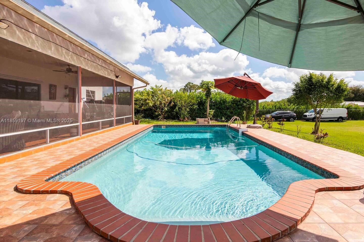 Price improvement! This exceptional Farm & Resort-Style property in Homestead/Redlands offers outstanding value and lifestyle. Featuring solar panels, a heated pool, a custom-built tiki hut, whole-house water filtration system, and lush Clusia landscaping for enhanced privacy, this estate has been thoughtfully upgraded for comfort and functionality.
Situated on over an acre, this private retreat blends tranquility with resort-style living while remaining conveniently located near major roads, shopping, and dining.
One of the rooms features a private bathroom and entrance, offering flexible use options.
Also available for rent at $6,500/month.