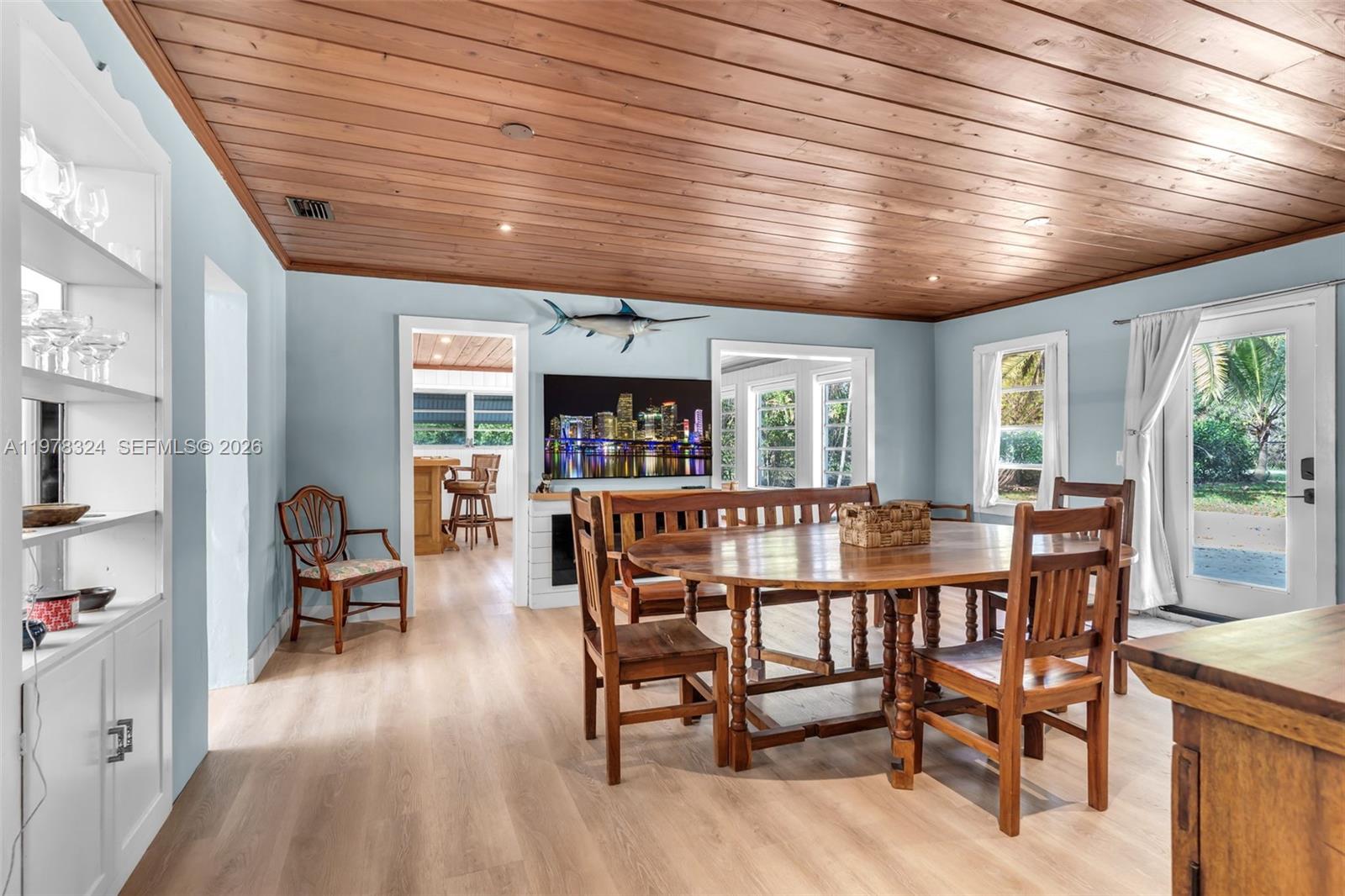 Captivating 3BD/2BA ranch-style home situated on nearly 2 acres, featuring a separate 2BD/2BA in-laws’ cottage—perfect  potential rental income. The main home has been remodeled and includes a new roof and A/C unit. Interior features include a Florida room with bar area, formal dining room, and family room, providing comfortable and functional living spaces. Unique construction details include a Dade County pine roof and a concrete ceiling in the master bedroom.

The in-laws’ cottage offers its own charm with a partial wrap-around patio and wood roof, creating a relaxing outdoor setting.

Outdoor amenities include a covered pergola over an outdoor BBQ/bar area and fire pit, ideal for entertaining. The property also features a well-maintained chicken coop and a post-frame barn, centrally located on the land. Plenty of space for gardening, hobby farming, or enjoying peaceful country living while still being conveniently located near local amenities.