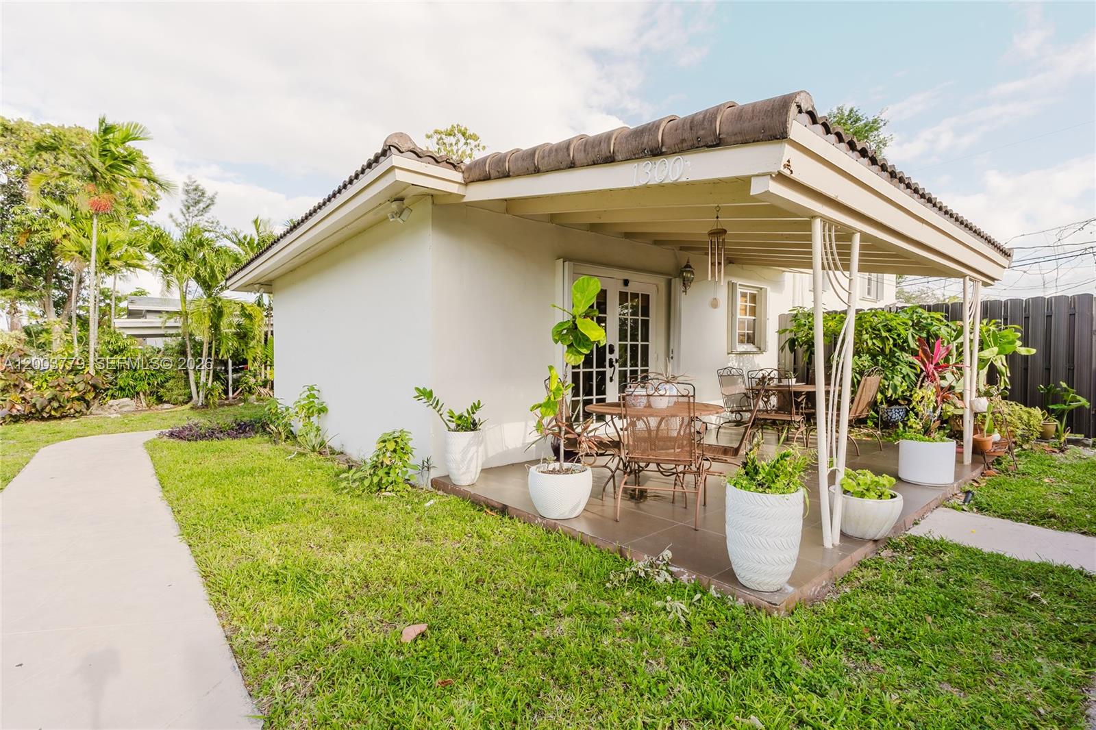 Step into this inviting home featuring an open and functional layout designed for everyday comfort. Enjoy generous living areas, a well-kept kitchen, and a private outdoor space perfect for gatherings or quiet evenings. This rare South Florida home offers a basement level with a family room and kitchen, a second level with formal living and dining areas, and a third level with three bedrooms and two bathrooms. An extra room with its own private bathroom provides excellent flexibility for in-law quarters or can be rented for additional income because it has a private entrance and plenty of parking.  Ideally located near shops, restaurants, parks, and major roadways, with easy access to I-95 and Miami International Airport. A must-see for buyers seeking space, versatility, and a well-cared-for home in a great location.  SEE BROKERS REMARKS FOR SHOWING INSTRUCTIONS.