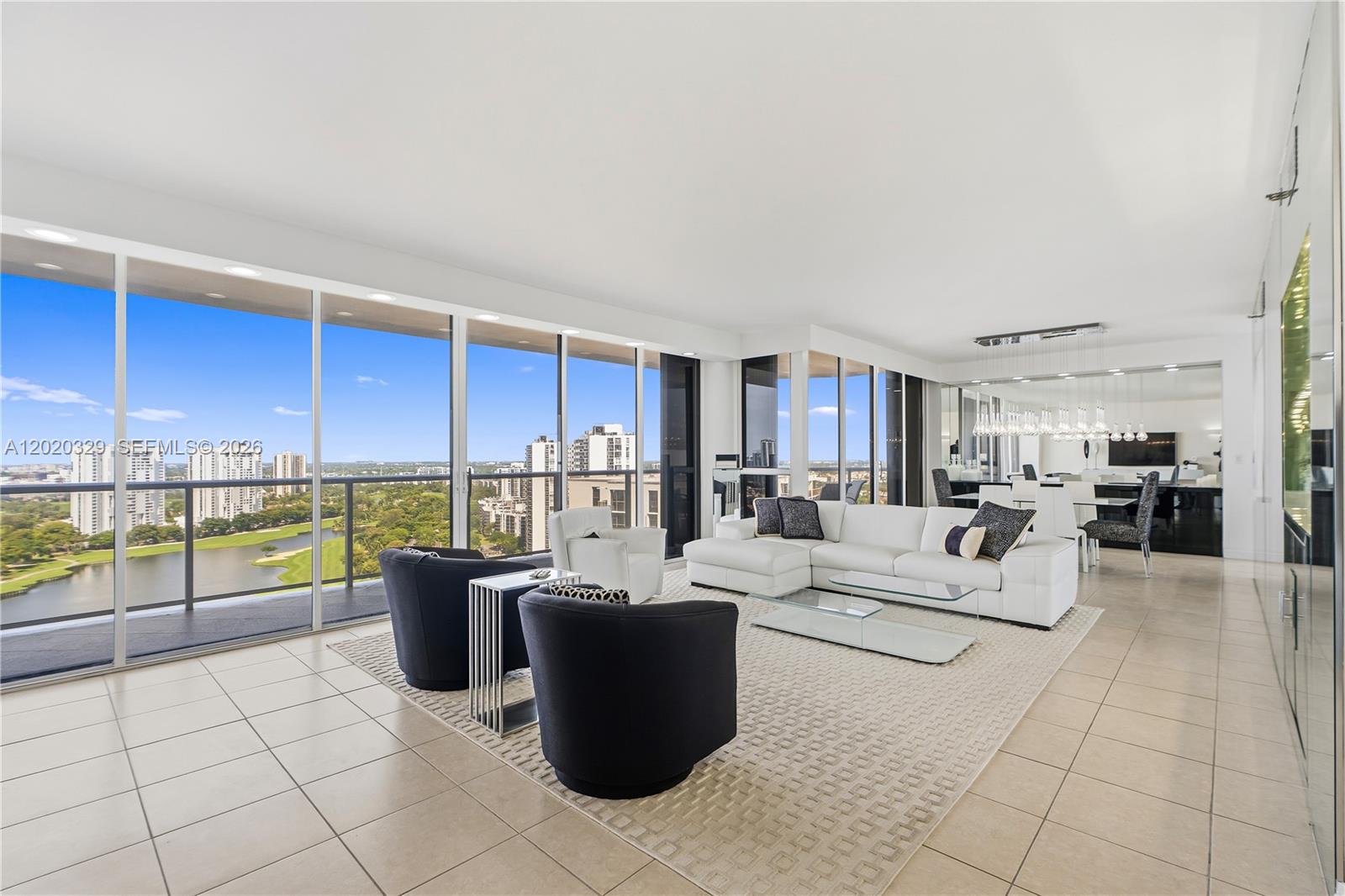 Just reduced $100,000! Bright, airy, and beautifully updated, this exceptional 2-bedroom, 2-bath residence showcases breathtaking views of the Intracoastal, ocean, golf course and lake seen within the unit and from the two expansive balconies. Filled with natural light throughout, the spacious split-bedroom layout features tile flooring throughout the main living areas and carpet in the bedrooms for added comfort.
The sleek modern kitchen is designed with white high-gloss flush cabinetry, white quartz countertops, an under-mount sink, mirrored backsplash, recessed lighting, and premium KitchenAid appliances. Both bathrooms have been upgraded; luxurious primary suite with a walk-in shower and separate jacuzzi. Additional highlights include electric shades throughout, an in-unit washer and dryer, hurricane shutters and generous indoor-outdoor living spaces perfect for relaxing or entertaining.
Experience resort-style living at The Hamptons, one of Aventura’s premier communities and among the few buildings with fully funded reserves for the past few years. Residents enjoy an unmatched array of amenities, including two pools, a private gourmet restaurant, Wi-Fi café, Movie Theater, a state-of-the-art fitness center and spa, tennis and racquetball courts, party rooms, children’s play areas, and more. Ideally located near beaches, fine dining, shopping, A-rated schools, houses of worship, and the popular Aventura Circle.