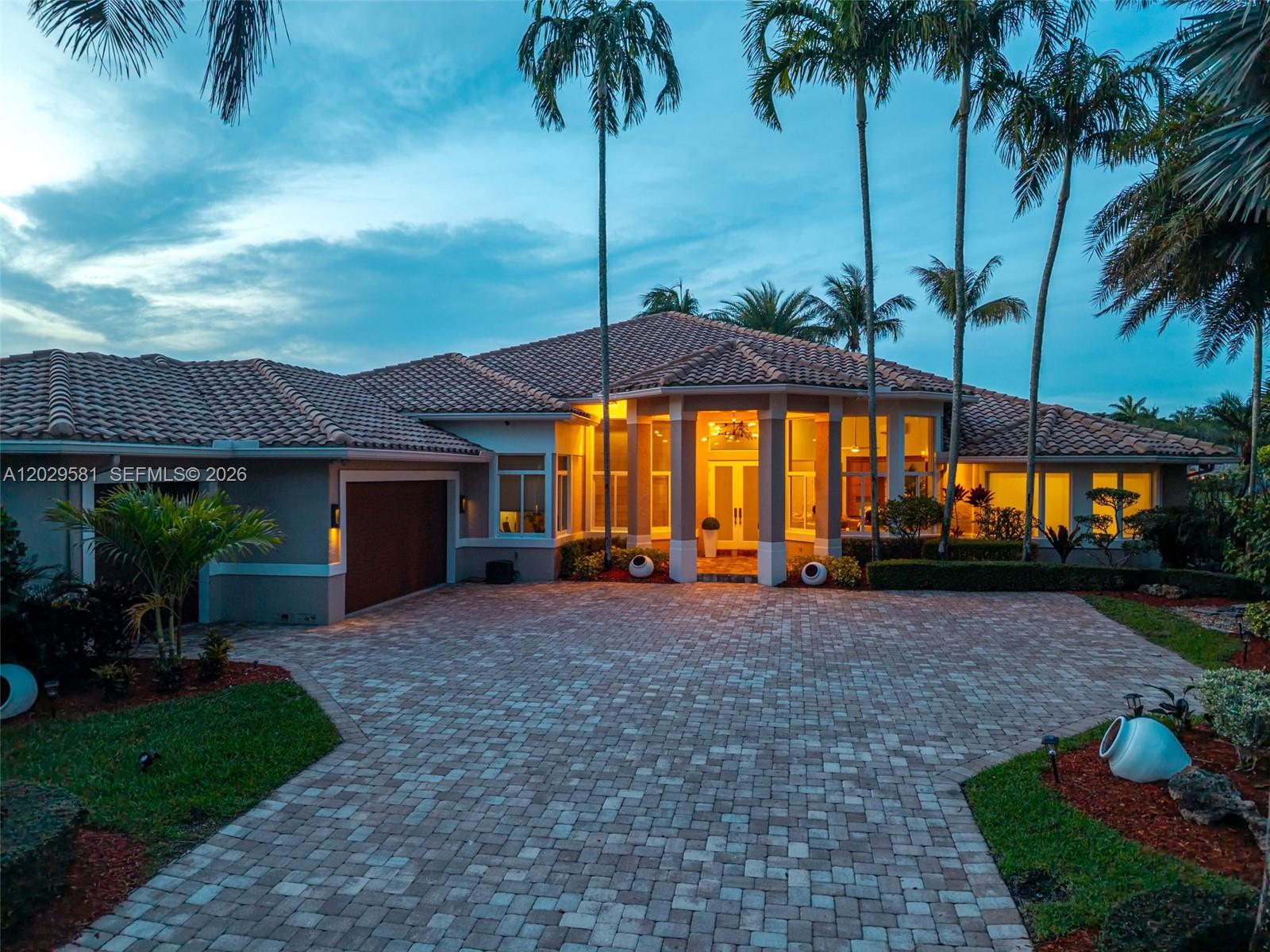 Fully renovated one-story lakefront residence in Weston Hills Country Club.

Located on a private 0.61-acre cul-de-sac lot, this home offers 5,275 sq. ft. of bright, functional living space with wide lake views and a seamless indoor-outdoor flow.

Designed for both everyday living and effortless entertaining, the home features six bedrooms, 6.5 bathrooms, formal and informal living areas, a dedicated home office, and a triple-split floor plan that balances privacy and connection throughout.

Natural light fills the interior throughout the day. High ceilings, expansive windows, and solid wood doors create openness, calm, and real acoustic privacy between living spaces.

The kitchen connects naturally to the family room, casual dining area, and outdoor terraces. Outside, covered terraces, a heated pool, barbecue area, and unobstructed lake views extend the living experience outdoors.

The primary suite occupies its own private section and includes direct pool access, dual walk-in closets, a vanity area, a spacious bathroom with soaking tub and oversized shower, and an adjoining room currently configured as a private gym.

Four additional bedrooms each include their own full bathroom and walk-in closet. A sixth bedroom offers flexibility as a media room, playroom, guest suite, or additional office.

High-impact windows and doors throughout. Whole-house water filtration. Three-car garage.

Furnished optional / Video tour available: https://youtu.be/R3gFNeQ26h4
