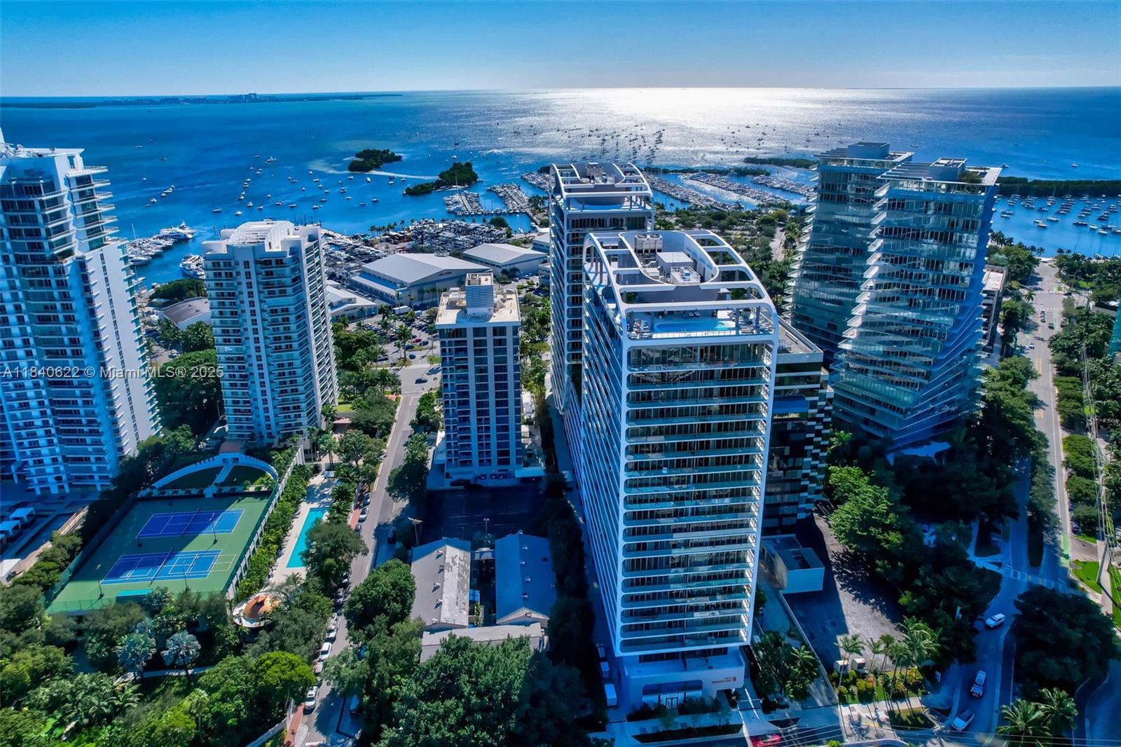 Welcome to Mr. C Residences, an outstanding example of contemporary architecture mingled with European elegance and located in spectacular Coconut Grove. Apartment 1401 is a 4 bedroom, 4.5 bath residence  located in the Bayfront Tower with a wrap around terrace offering captivating views of Biscayne Bay as well as spectacular views of the Miami skyline. Details include  Italian cabinetry,premium appliances and finishes.Unit features soaring 11 ft  ceilings, floor to ceiling windows as well as 2 Primary bedrooms, 3 PARKING SPACES,VALET SPACES AND SEPARATE STORAGE UNIT UNDER A/C. Residents will enjoy 24 hour concierge & butler services, state of the art fitness center,Peloton room, yoga & Pilates room, Playroom, Teen Room, library, business center, media room,2 pools, club and billiard room.