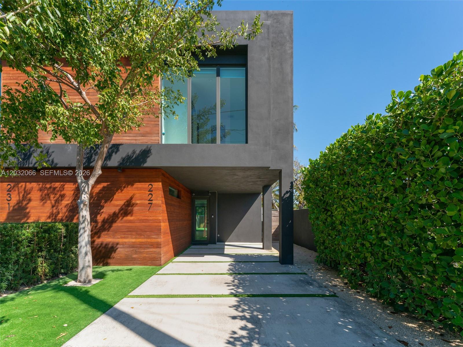 Two blocks from the Design District, this modern townhome puts you in the heart of one of Miami's most creative neighborhoods. Three bedrooms, two and a half baths, and a clean contemporary design built for easy living. The designer kitchen features high end appliances and opens to bright living areas finished with warm flooring. Impact windows and doors run throughout, filling the space in natural light. A private pool sits just beyond the living areas, offering a quiet place to unwind. The home is move in ready and the location is a big part of the appeal. This address has supported strong rental demand, making it a proven option for investors as well as owner occupants. Step outside and you are surrounded by fashion houses, furniture showrooms, and some of the city's best dining. Wynwood, Midtown, Edgewater, and Brickell are minutes away, and quick access to I 95 and Miami International Airport keeps the rest of the city within reach.