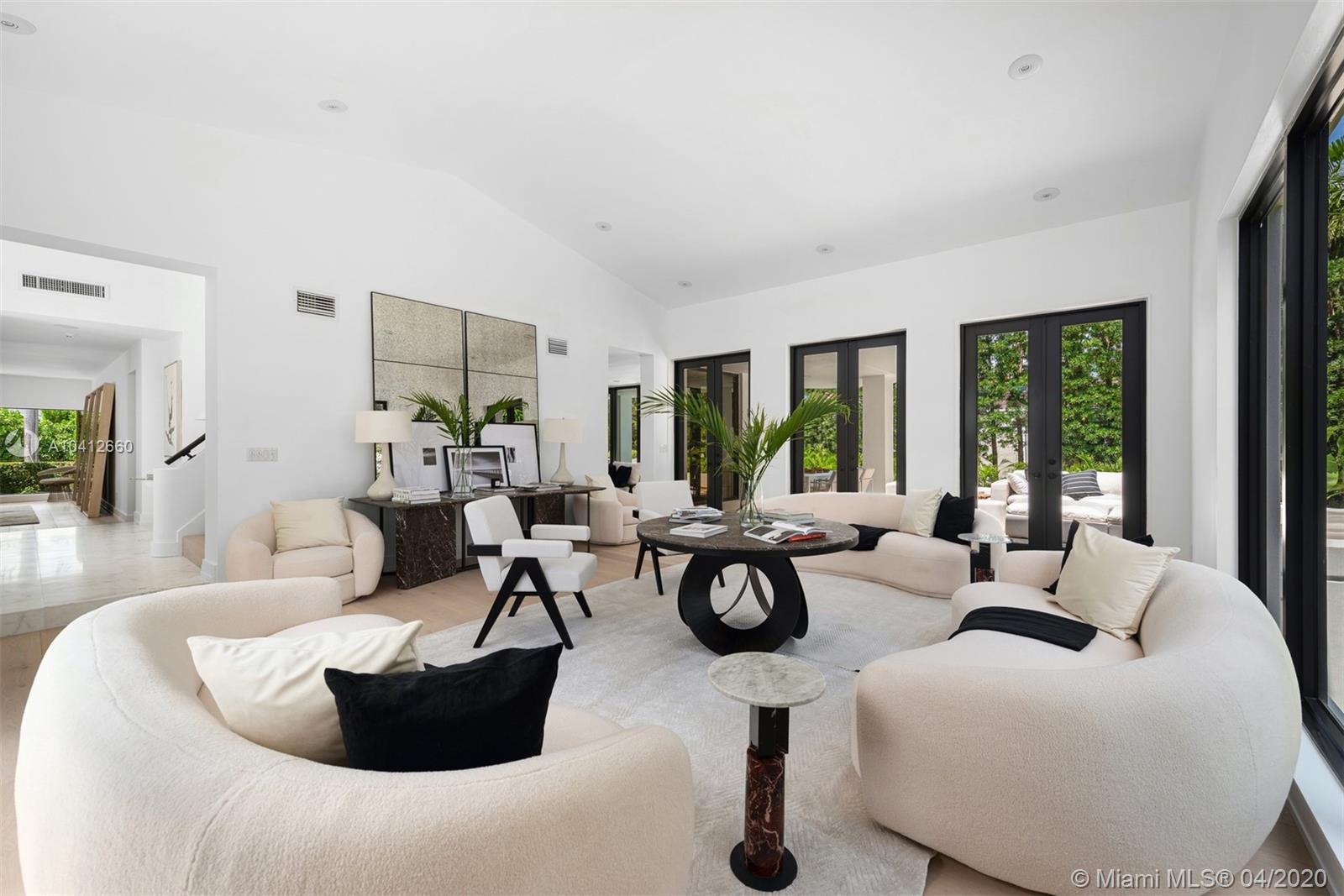 This luxurious modern home (2020 renovation) is situated on a spacious 12,500 SF corner lot on prestigious Sunset Island II. An exquisite marble foyer and soaring 20-ft ceilings greet you upon entering this 4Bed/4.5Bath home. Elegant wide plank European oak floors are bathed in extraordinary natural light. Eat-in kitchen, w/custom cabinetry, a separate pantry, a gorgeous marble waterfall island, and Wolf, Sub-Zero & Miele appliances. Spacious master-suite features two large walk-in closets and a dream bathroom w/soaking tub, Kohler fixtures, decorator-designed Italian Calacatta Gold marble shower, and his & her marble sink vanity. Smart lighting & smart home security. Powder room by Waterworks. Maid’s suite. Backyard oasis w/sparkling pool & the privacy that only Sunset Island can offer.