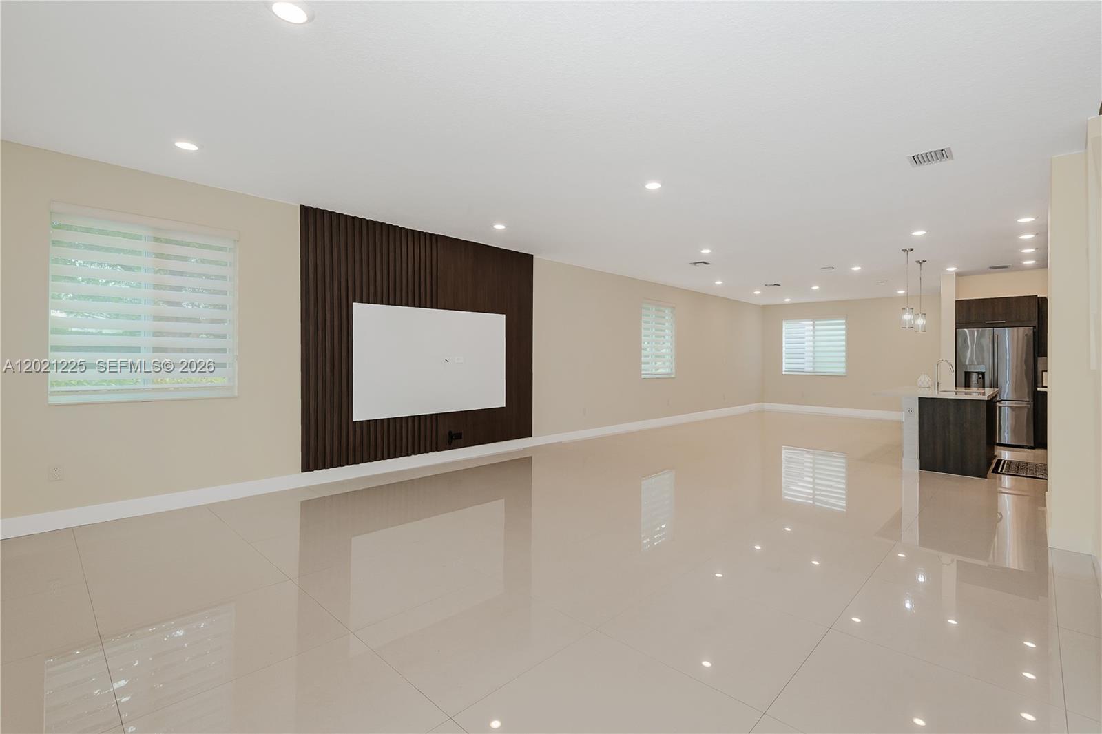 Modern corner townhouse with private NEXT-GEN studio in highly sought-after Landmark at Doral. This spacious 2-story, loft-style residence offers 4 bedrooms and 3.5 bathrooms in total, including a fully equipped private studio with its own entrance, kitchen, bathroom, laundry, and dedicated side parking—perfect for in-laws, guests, a home office, or can be rental income. This Separate unit from the main House can also be rented  out for over $1800 per month making this an excellent opportunity for investors or families seeking additional cash flow. Flooded with natural light from its premium corner lot, the home features an open modern layout, oversized porcelain tile floors, wood stairs, high-impact windows and doors, and a sleek kitchen with stainless steel appliances, wall oven, and quartz countertops. The generous primary suite includes a huge walk-in closet, and the 2-car garage provides plenty of storage and convenience.
Residents enjoy a true resort-style lifestyle with an impressive clubhouse offering a sparkling pool and kids’ splash park, tennis courts, fitness center, spa/sauna, game and social rooms, open-air amphitheater, and multiple parks and BBQ areas. Ideally located near A-rated schools, including the renowned Doral International Math and Science Academy, this home is just minutes from Miami International Airport, major highways, top shopping centers, supermarkets, hospitals, and the vibrant dining and entertainment of Downtown Doral.
