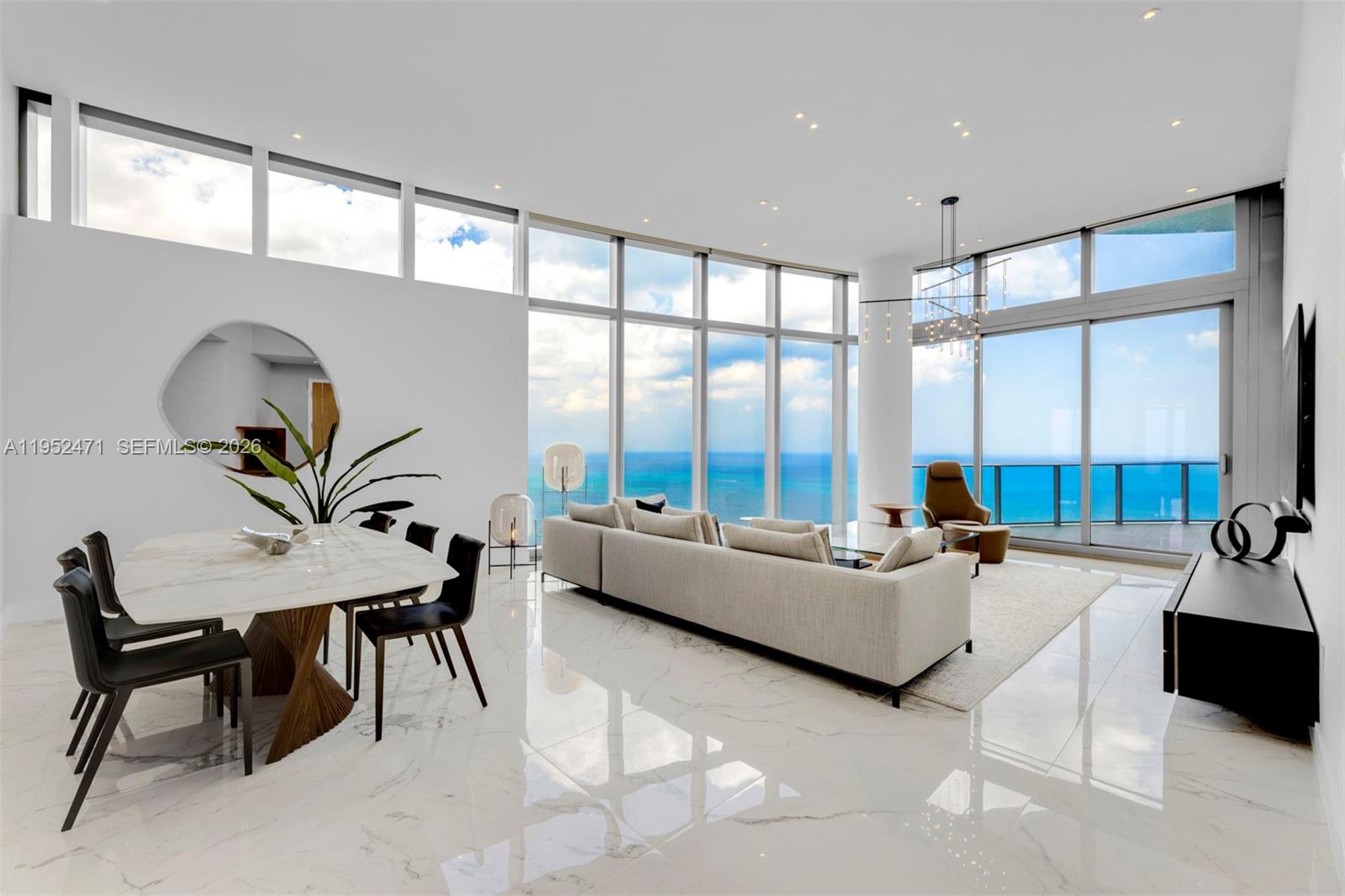 Sky Villa 4701 at Ritz Carlton Residences Sunny Isles redefines extraordinary. From the moment you step off the private elevator into this one-of-a-kind space in the sky, it’s easy to see just how far this residence has separated itself from anything else on the South Florida market. 13 ft. volume ceilings, floor-to-ceiling windows, panoramic ocean views and magnificent sunsets, two terraces, over 3,000 sq. ft. with 3 Bedrooms, 4.5 Bathrooms plus a Den.  Finished with Marble Floors, and perched near the top of the building, this is the tallest residence available at the Ritz. Italian Gourmet Kitchen with Gaggenau appliances, Wine Cooler, and built-in Cappuccino maker, opens up to the oceanfront Dining Area and Living Room.  The Ritz Carlton's amenity package includes: Private Elevator, 24hr Concierge, valet, oceanfront spa and fitness center, beach & pool service, two private pools, & on-site restaurant.