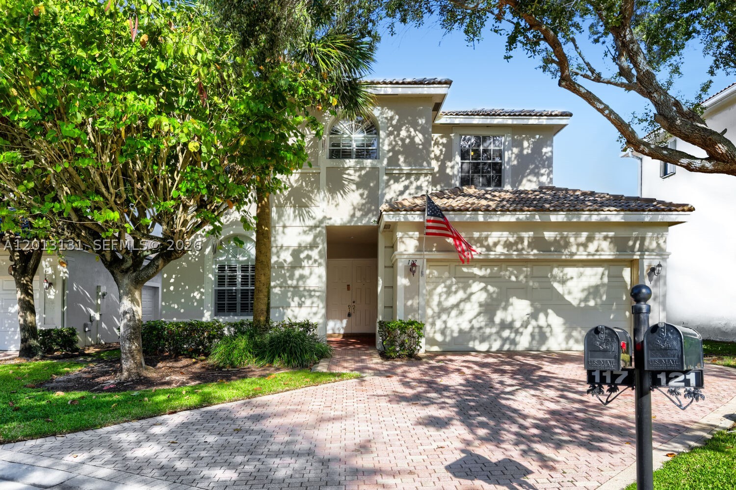 This spacious 4-bedroom, 3-bathroom two-story CBS (Concrete Block System) home offers a robust build and a sprawling floor plan designed for both comfort and utility. Upon entry, you are greeted by a grand living area featuring impressive vaulted ceilings that enhance the sense of space. The layout flows into a family room at the rear, which provides serene views of the lake area. The kitchen is a standout for home chefs, featuring a double oven and appliances that appear to be in good working order.

The home is thoughtfully zoned with a first-floor primary suite for maximum privacy and convenience. Also located on the main level is the laundry room and a versatile second bedroom, which currently serves as an office with views overlooking the front property. The remaining two bedrooms are situated on the second floor. For those with hobbies or extra gear, the 2-car garage includes a unique side-entry door specifically designed for easy access for bicycles or motorcycles.