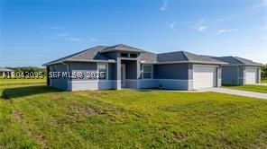 This custom-designed Banyan Village home offers modern comfort, quality craftsmanship, and a thoughtfully designed layout. Featuring 3 bedrooms plus an office/den, or possible 4th bedroom and 2 beautifully finished bathrooms, the home showcases stunning tile flooring throughout and soaring 9'4" ceilings that create a bright, open feel. The kitchen is highlighted by custom-selected quartz countertops and ample space for everyday living and entertaining. The spacious primary suite includes dual vanities, separate his-and-hers closets, and a private retreat atmosphere. Impact-resistant windows and doors provide peace of mind, while the laundry room is equipped with a convenient sink. The 2-car garage is currently set up as a home gym, offering flexible use of the space. Outside, a large covered lanai provides the perfect spot to relax or host guests. To make your move even easier, the home is being sold with all current furnishings, appliances, and home gym equipment included, offering exceptional value and convenience for the next owner.
