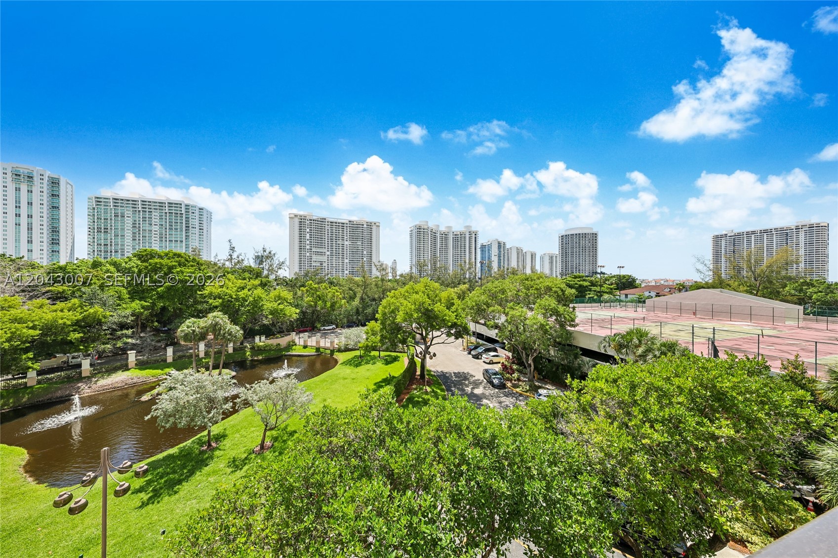 Great garden view and Largest layout 2-bed, 2-bath residence in the highly sought-after Williams Island community. This beautifully maintained condo features real parquet flooring throughout, a new A/C system, impact windows, and an oversized primary suite with two walk-in closets. The second bedroom also offers generous closet space, including a walk-in closet. Unit includes 1 assigned covered parking space. Second car is valet. Enjoy resort-style living in a full-service building with a heated pool, tennis court, fitness center, and exceptional amenities. Ideally located just minutes from Aventura Mall, Sunny Isles Beach, houses of worship, Fresh Market, fine dining, and premier shopping. PLEASE READ BROKERS REMARKS