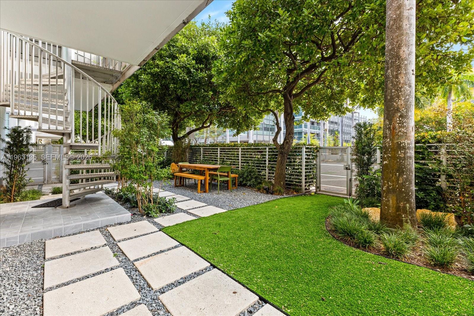 Rare South Beach loft with a large private garden, designed for seamless indoor-outdoor living. This chic, modern 2 bedroom, 2 bath residence features soaring 10' ceilings, wood floors, expansive windows, and a spacious balcony with a spiral staircase connecting directly to the garden and its private street entrance. The flexible second bedroom doubles as a guest room or office.  Montclair is a boutique building with a rooftop pool and a prime central location just steps from Lincoln Road, the Convention Center, dining, and the beach. Includes one covered parking space. rooftop pool area and centrally located adjacent to Lincoln Road, the Convention Center, restaurants and ocean. Unit comes with 1 covered parking space.