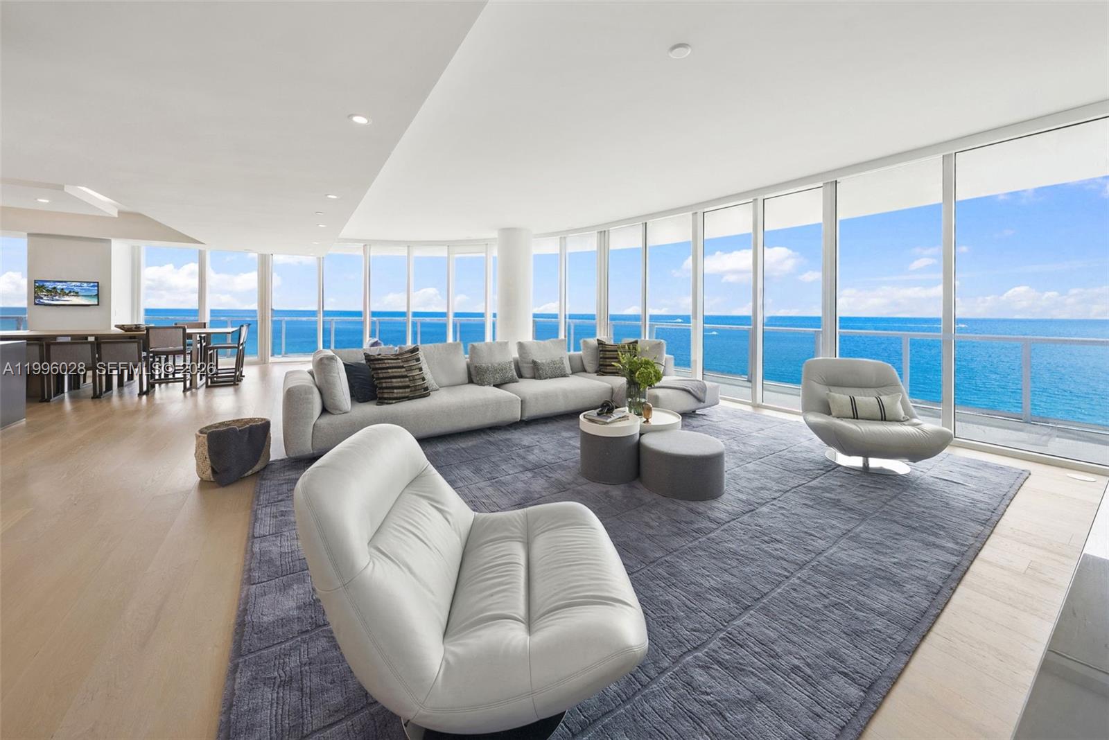 Rarely available and most coveted combination of 2 units with direct ocean views. A private foyer with direct elevator access leads into this spacious flow-thru floor plan consisting of 5 bedrooms 4 full baths and a media room, spanning 4378 sq.ft. of living space and a wrap around balcony, light Oak floors, chef's kitchen with cooking island, double ovens, double dishwashers and pantry closet perfect for entertaining and large families. Continuum offers 13 acres of luxurious resort amenities such as 1000 FT of white sandy beach, full service beach/pool club, 2 lagoon shaped pools, restaurant/bar, 3 tennis courts with Pro-Shop. Gym/spa, lap pool, security, valet and
concierge, 3 assigned parking spaces.