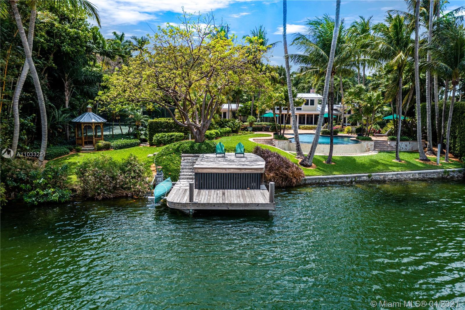 Situated in Hammock Lake, one of the most desirable gated communities in Coral Gables, this gorgeous 6,427 Sq. Ft. home, with 4 BR and 2.5 BA, showcases breathtaking lake views, elegant light-filled living spaces, and resort-like gardens, offering a peaceful and harmonious connection with nature. The home includes a living room with fireplace, formal dining room, and chef's kitchen with walk-in pantry, Wolf and Sub-Zero appliances, and an eat-in island that opens to a gracious sunroom. A charming wood staircase leads from the foyer to the second-floor main suite, with a luxurious bath. Designed for comfortable living, the home also features a theater room with custom-made bar, office, gym, screened-in porch, beautiful infinity pool and tennis court.  A captivating retreat in Coral Gables.
