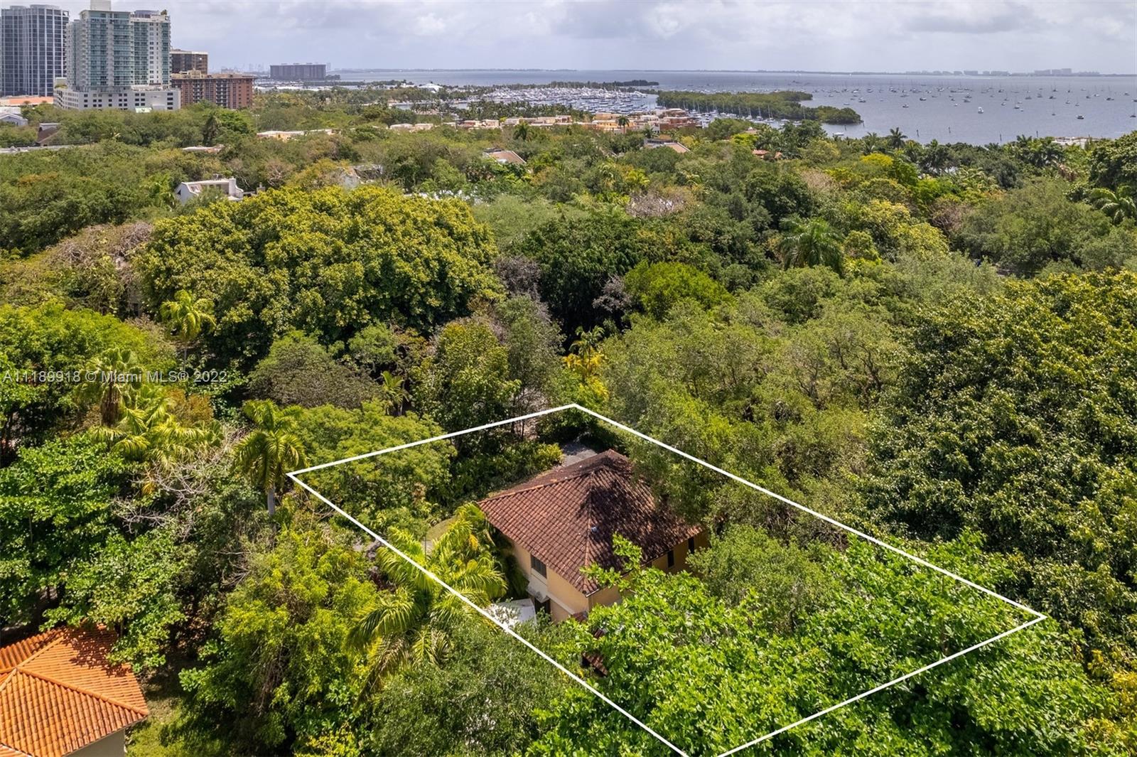 There are few Coconut Grove enclaves as magical as the Camp Biscayne gated community. Situated next to the Barnacle Historic State Park and moments from excellent schools and great dining, shopping and entertainment venues, Camp Biscayne offers exceptional natural beauty, privacy and a highly convenient location. This particular 22,450 SF lot, with a sparkling pool and mature landscaping, is offered as a land sale or a remodel opportunity, and comes with fully permitted plans for a gorgeous home, courtyard, pavillion kitchen and lounge. Photos also include conceptual renderings.