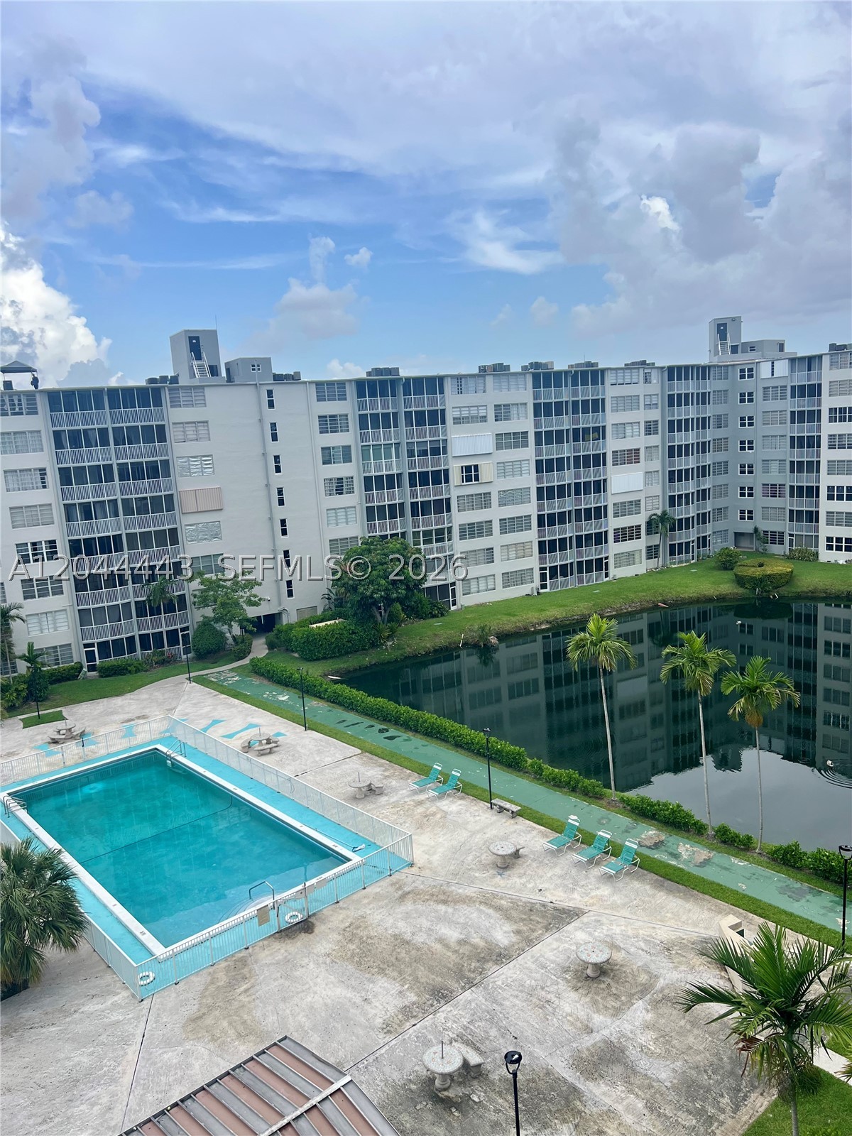 Great location for this 1 bed plus Den apartment. Den is closed, which makes this a 2 bedroom and 1.5 bathrooms condo. Lowest priced apartment in the building, priced to sell, won't last long. Laundry room in each floor, pool and elevators for easy access.  One assigned parking right outside the building and extra guess parking. Located in a gated community closed to Publix, CVS, Walgreens. Excellent opportunity for investors or as a prime residence.