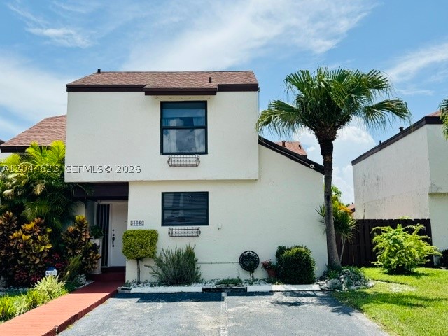 Beautifully townhouse in gated community near MIA, Doral, and major highways. This spacious 3-bedroom, 2-bath residence features a first-floor bedroom ideal for guests or in-laws, a large living area, and an upgraded kitchen with granite countertops and tile backsplash. Enjoy two assigned parking spaces in front of unit, plus visitor parking available. The primary suite includes a beautifully remodeled bathroom. Community amenities include two pools, serene lake, tennis courts, gated entry, and a roaming security guard.