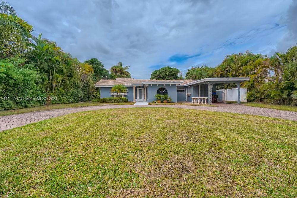 Prepare to be impressed as you enter this well-maintained 3 bedroom, 2 bathroom home located on a large corner lot in Lake Clarke Shores, with no HOA! A large living room greets you with a fireplace and a formal dining room as you enter the home. You will fall in love with the kitchen, featuring a pantry, beautiful cabinets, and sleek appliances. The primary bedroom highlights a large closet and an ensuite with a soaking tub. In addition, this home has a fantastic screen patio that opens to the large private backyard, great for relaxing and entertaining guests. This home is conveniently located near the West Palm Beach Golf Course, I-95, restaurants, shops, parks, and schools. Do not miss seeing this impressive home!