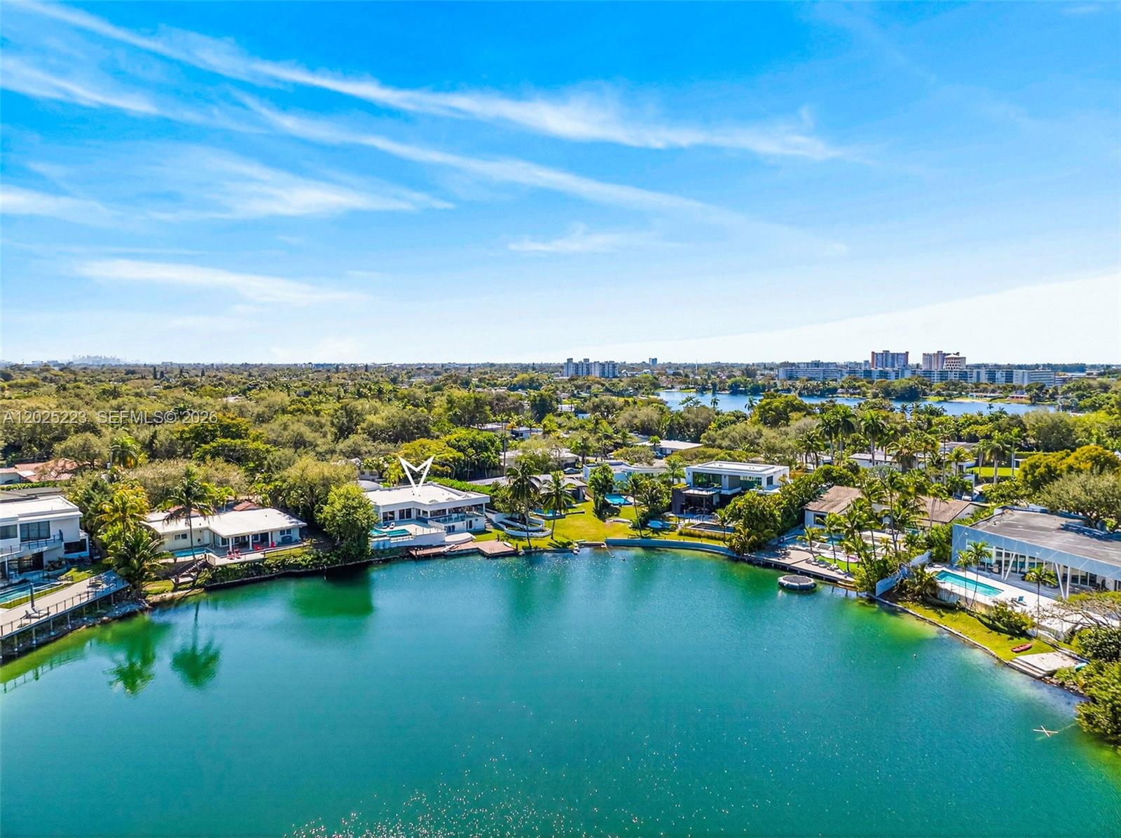 Dive into the enchanting lifestyle of lakeside living! This stunning property offers unparalled privacy!!! 
Five spacious bedrooms and four full baths. Lot of over 12,000 square feet with a big lawn area. 105 feet of prime waterfront with stunning views in the desired Skylake neighborhood. Enjoy your very own pool, and lake activities, such as swimming and boating. Fully equipped outdoor covered kitchen and bar. Outdoor living room and an outdoor shower. There's a recording studio that doubles as in-laws quarters with a full bathroom that has it's ownseperate entrance. Located minuets from beautiful beaches, the Aventura Mall, exciting restaurants, parks, and houses of worship.