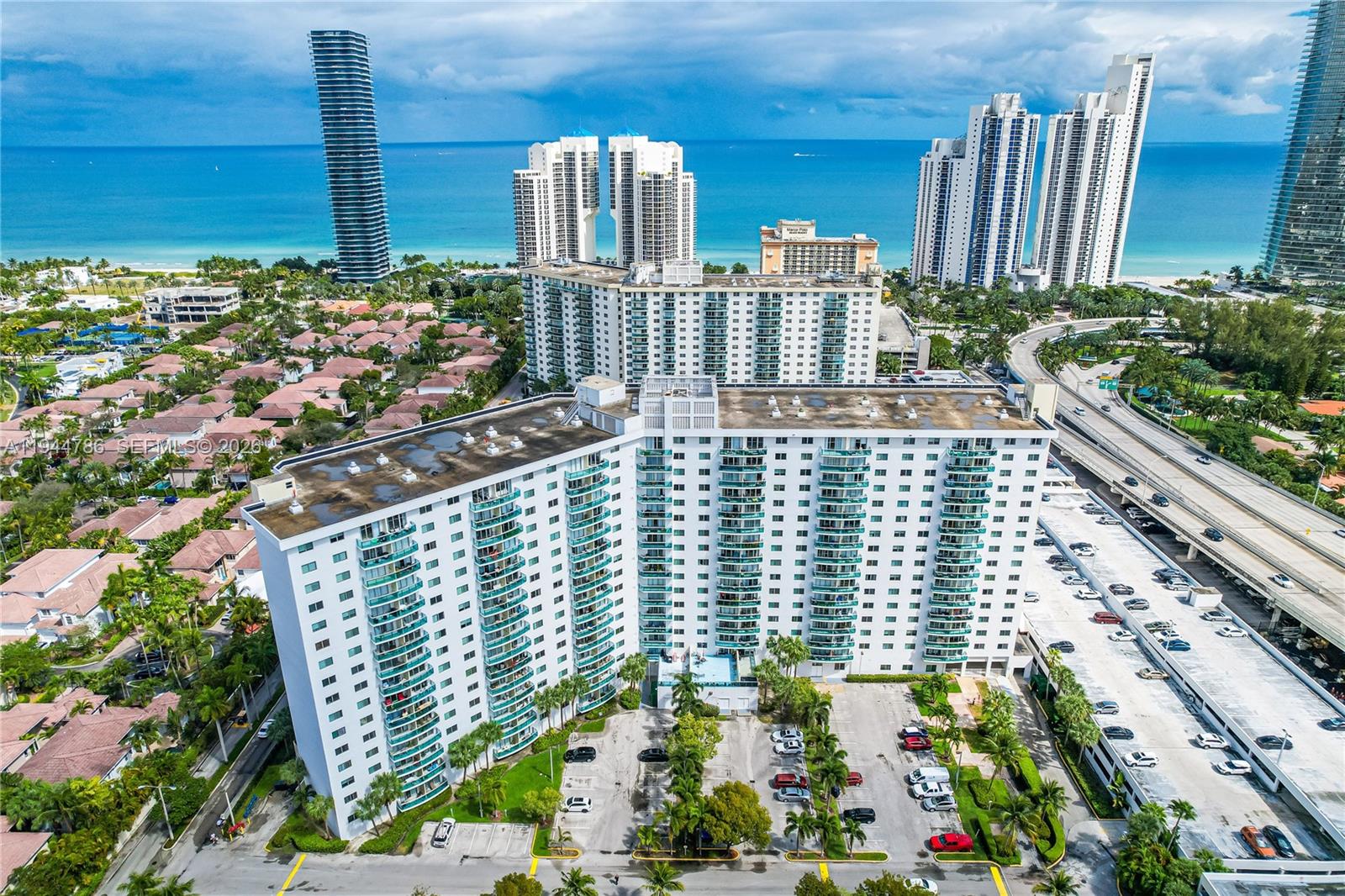 Your keys to a new life in a premium beach condo in the prestigious city of Sunny Isles Beach. Oversized, upscale, 1-bedroom, 1.5-bathroom residence featuring 1,005 SF of beautifully renovated living space. Open-concept kitchen with tile flooring and modern top tier fixtures and materials throughout the entire place. The floor-to-ceiling sliding glass doors flood the space with natural light. Both the ensuite bathroom and half bathroom have been remodeled with tailored finishes and the bedroom offers a custom-made walk-in closet. There are appealing resort style amenities on premises including tennis courts, gym, heated pool, social room, game room, lounge, and dog-walk field. Steps from Heritage Park and the beach, minutes from haute cuisine establishments, supermarkets, banks, cafes, and Aventura Mall. Ideal for first-time home buyers, investors, or those seeking a luxurious beach getaway. Located in a fully compliant, fully funded, well-managed building with a recently reduced HOA. The building has impact windows and doors, completed certifications and has undergone upper-class interior renovations on all floors with special assessments paid in full providing worry-free ownership experience for the new buyer.