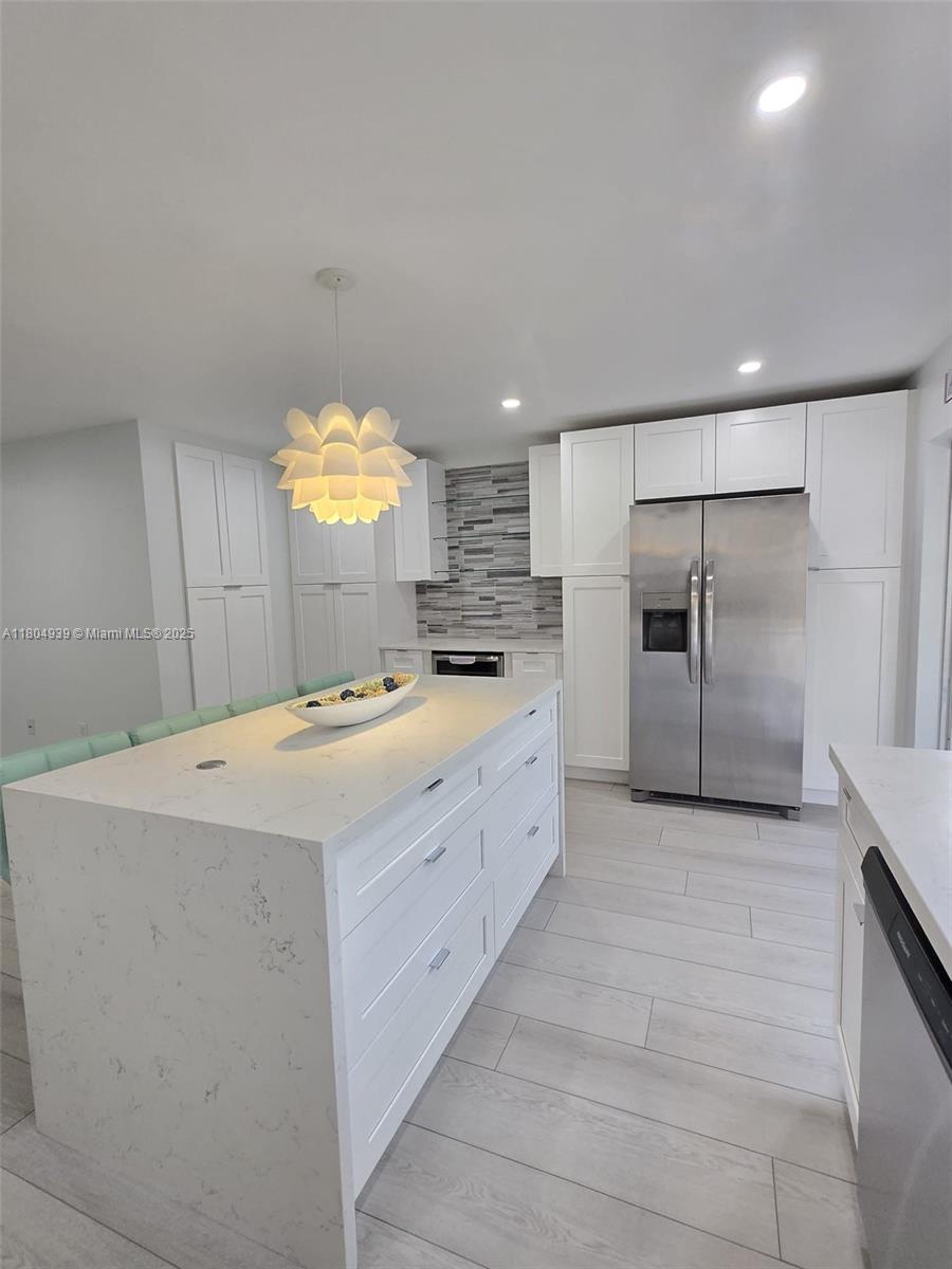 Beautiful 2/2 Villa completely renewed open concept in great location! Must see! Updated kitchen with white quartz counter top. Unit includes washer and dryer and hurricane shutter protection and a nice size yard.2 parking spaces assigned. Great Location, close to main highways (826, I75 and turnpike). Near shopping, medical center, shopping, banks, restaurants.