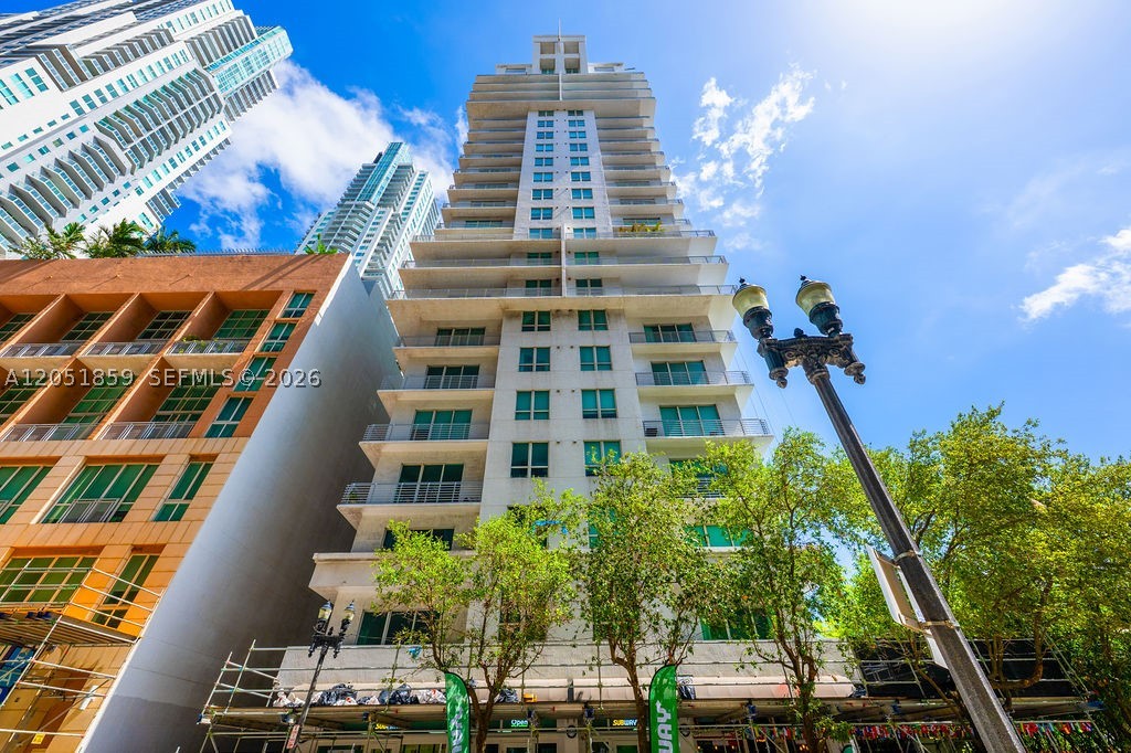 Experience true loft-style living in this bright, open-concept one-bedroom, one-bath residence at The Loft Downtown Miami. Unlike many units in the building, this home features a fully enclosed bedroom and an additional closet added by the previous owner, providing valuable extra storage. Soaring 10-foot ceilings, abundant natural light, modern finishes, stainless steel appliances, and an efficient layout create an inviting Downtown home ready to make your own. Flexible occupancy and closing dates can be accommodated. Brand-new modern flooring flows throughout the living area, while large windows and balcony doors fill the residence with natural light. The L-shaped kitchen features sleek white high-gloss cabinetry, modern countertops, and a stainless steel appliance package. The stylish bathroom offers a vanity, brass-and-globe lighting, and spa-inspired finishes. Hurricane-impact windows and a private balcony complete the space.
Enjoy the best of urban Miami living with low HOA dues that include water and internet! Building amenities include a pool, fitness center, sauna, steam room, club room with billiards, a two-story Zen-inspired lobby, and 24-hour front desk and security. Resident parking is conveniently located across the street. Steps from the MetroMover, Bayside, Bayfront Park, Kaseya Center, Miami Dade College, and Miami Worldcenter, with easy access to Brickell, Edgewater, Miami Beach, Wynwood, and the Design District.