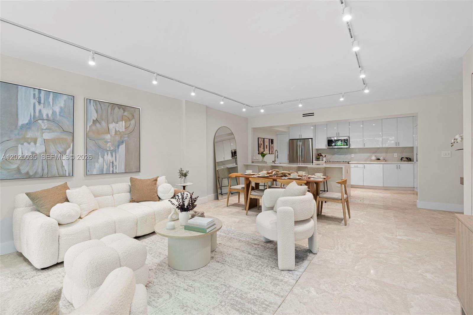 Beautifully renovated 2BR/2BA residence at Commodore Club West in Key Biscayne featuring an open-concept kitchen and elegant high-end finishes throughout. Completely remodeled bathrooms, new AC, custom closets, upgraded doors, and in-unit washer/dryer. Filled with natural light and overlooking tranquil garden views, this turnkey residence is located in a desirable oceanfront building offering direct beach access with beach chair and umbrella service, tennis courts, pool, gym, and resort-style amenities in the heart of Key Biscayne.