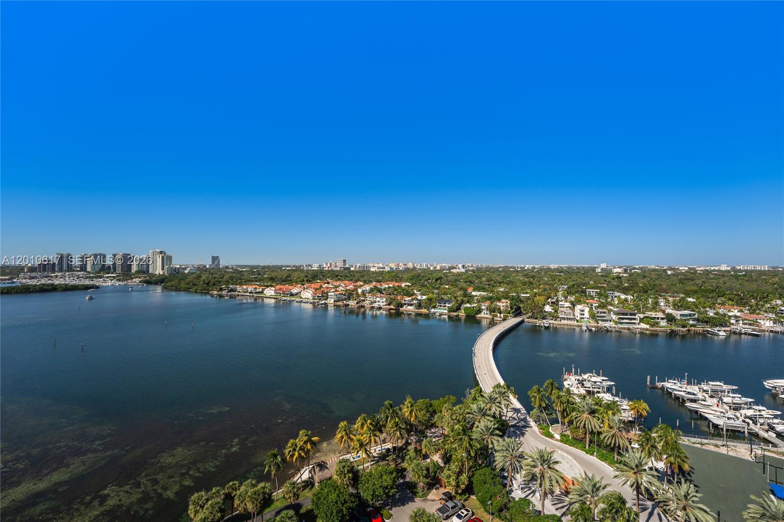 Come to paradise on this private, secure island offering resort-style living at its finest. Enjoy multiple swimming pools, tennis courts, expansive walking paths, and a children’s playground. Rarely available PH4 in Building 1, featuring a south exposure with unobstructed views of the Bay, the Ocean, and Coconut Grove. This 2-bedroom, 2-bath split floor plan residence is beautifully updated with custom built-ins and opens to a large private balcony, perfect for relaxing or entertaining while taking in breathtaking vistas. Walking distance to Coconut Grove, restaurants and shops.