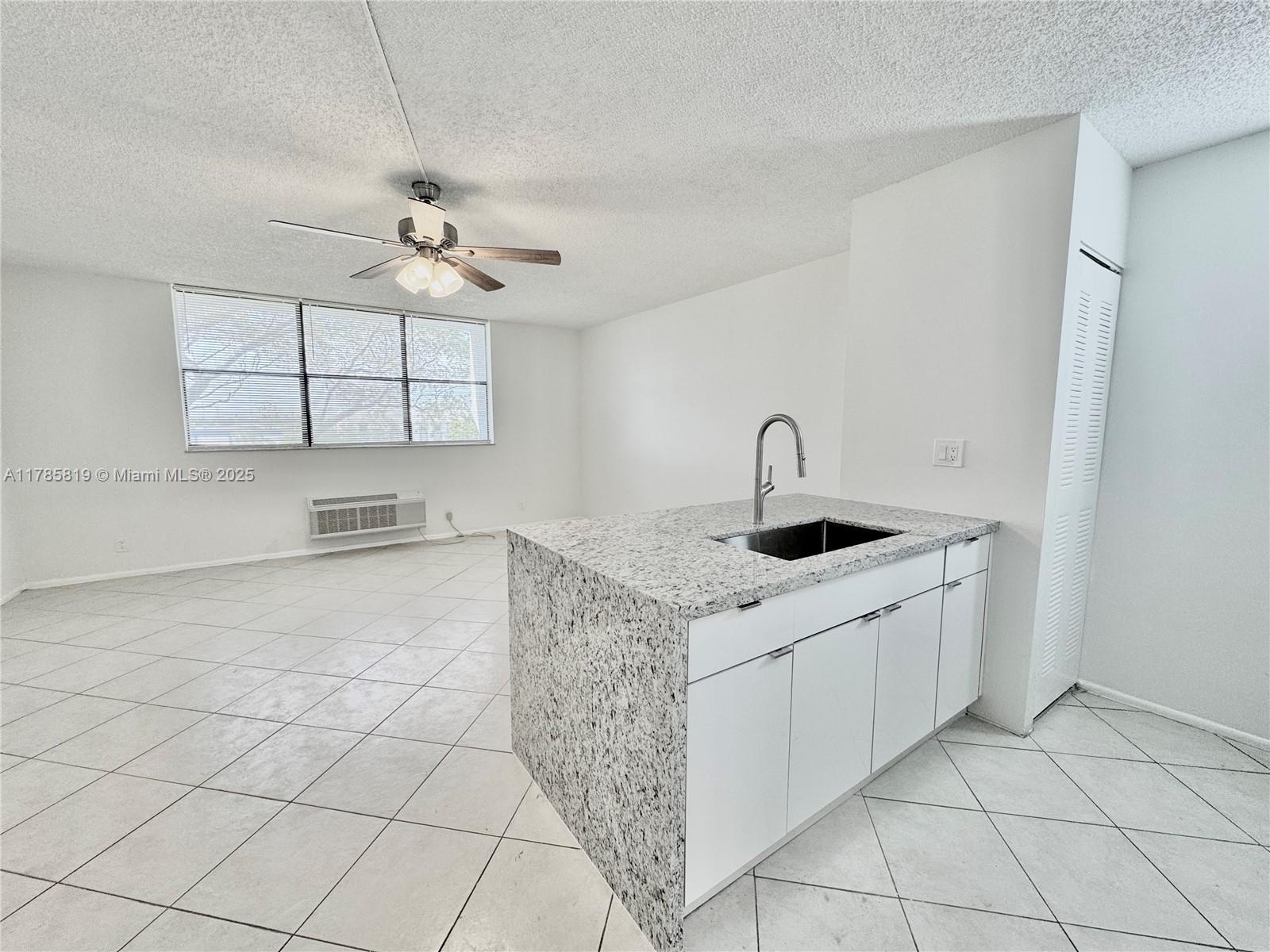 ONLY 1ST MONTH & SECURITY DEPOSIT - Beautiful Move-In Ready Studio in the Heart of Coral Springs! Don’t miss this beautifully updated studio apartment featuring brand new kitchen cabinets, sleek granite countertops, stainless steel appliances, and elegant tile flooring throughout. The spacious walk-in closet offers ample storage, and the rent includes water, trash, and one assigned parking space. The building provides secure entry and fantastic community amenities such as a sparkling swimming pool and a relaxing hot tub. Conveniently located close to major highways, public transportation, shopping, dining, and everything Coral Springs has to offer. Stylish, affordable, and centrally located — this gem won’t last! Fast association approval – schedule your tour today!