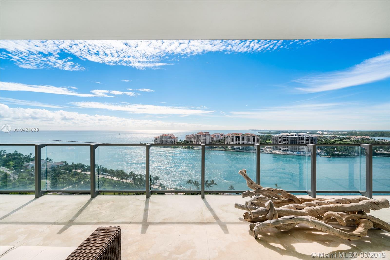 Enjoy incredible views of the ocean, Fisher Island, and the South Beach scenery from this South/North facing residence in the prestigious Apogee South Beach condominium in South of Fifth. This rarely available 3-bedoom 4-bathroom + den unit offers a flow-through floor plan, high-end finishes, wood floors, large living room, open style kitchen with an island and Miele appliances next to the family room, master suite with a spa-like bathroom with glass walls, and 3 large bedrooms. The 11-foot wide balconies feature a summer kitchen for the ultimate entertaining experience. Unit comes with an air-conditioned 2.5-car garage and a private elevator. Indulge on the luxurious amenities offered by Apogee: new pool area, gym, valet, security, beach services.