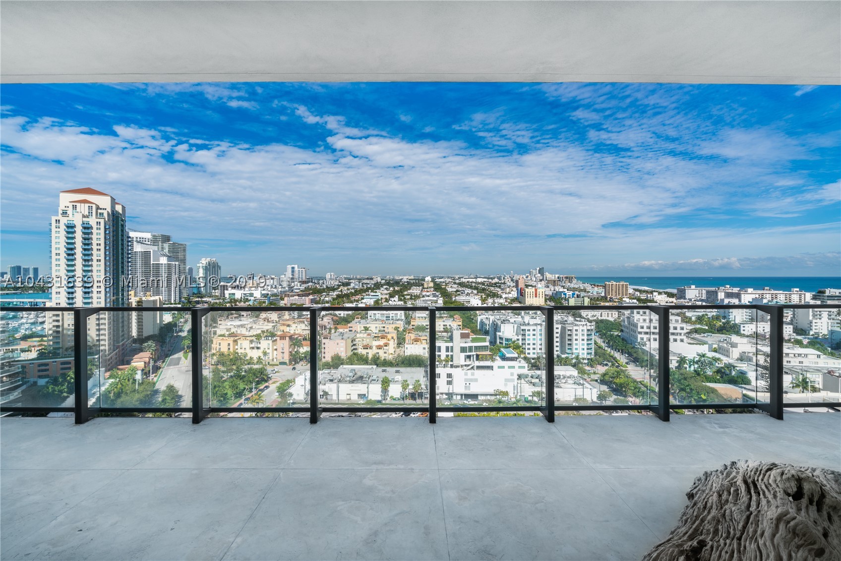 Enjoy incredible views of the ocean, Fisher Island, and the South Beach scenery from this South/North facing residence in the prestigious Apogee South Beach condominium in South of Fifth. This rarely available 3-bedoom 4-bathroom + den unit offers a flow-through floor plan, high-end finishes, wood floors, large living room, open style kitchen with an island and Miele appliances next to the family room, master suite with a spa-like bathroom with glass walls, and 3 large bedrooms. The 11-foot wide balconies feature a summer kitchen for the ultimate entertaining experience. Unit comes with an air-conditioned 2.5-car garage and a private elevator. Indulge on the luxurious amenities offered by Apogee: new pool area, gym, valet, security, beach services.