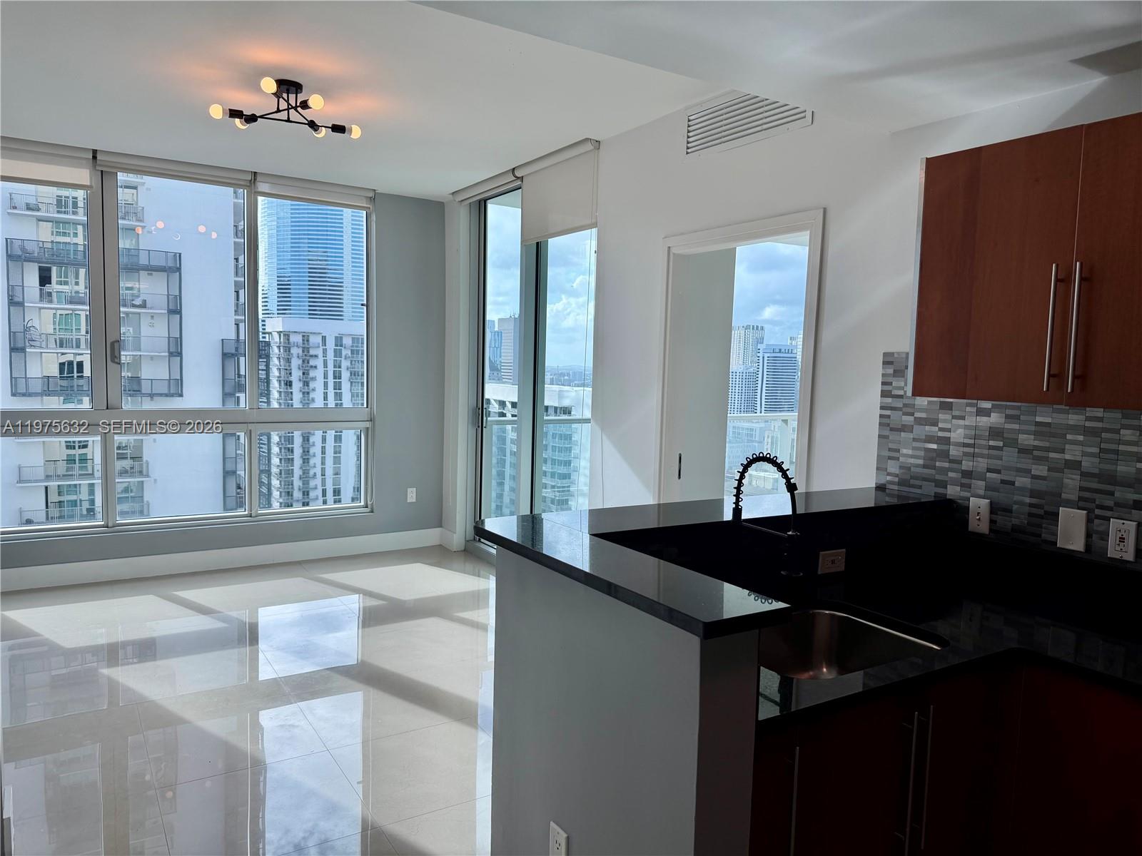 Met 1 rarely available and most sought after "11" line! Welcome to urban living at its finest! Discover the epitome of modern comfort and convenience in this stunning 1BD/1BA condo nestled in the heart of downtown. Boasting a prime location that offers an effortless blend of urban excitement and tranquil living, this condo is the ideal haven for those seeking a dynamic lifestyle without compromising on comfort. Tile floors inside and out. Northwest exposure with partial water views. California walk-in closet. Black-out curtain in the bedroom, privacy shades in the living room. Newer back splash in the kitchen. Washer & dryer in unit. New LifeFitness gym equipment. Corner unit, no neighbors. One assigned parking space. Steps to Aston Martin bay walk, Whole Foods Market, Bayfront Park, Novikov Restaurant, Joe & the Juice, Gordon Ramsay Hell's Kitchen among many others plus 17 screens' Silverspot Cinema. Minutes from metro mover, Brickell City Center, Kaseya Arena & Arsht Center for the Performing Arts. Chic downtown living at its best!